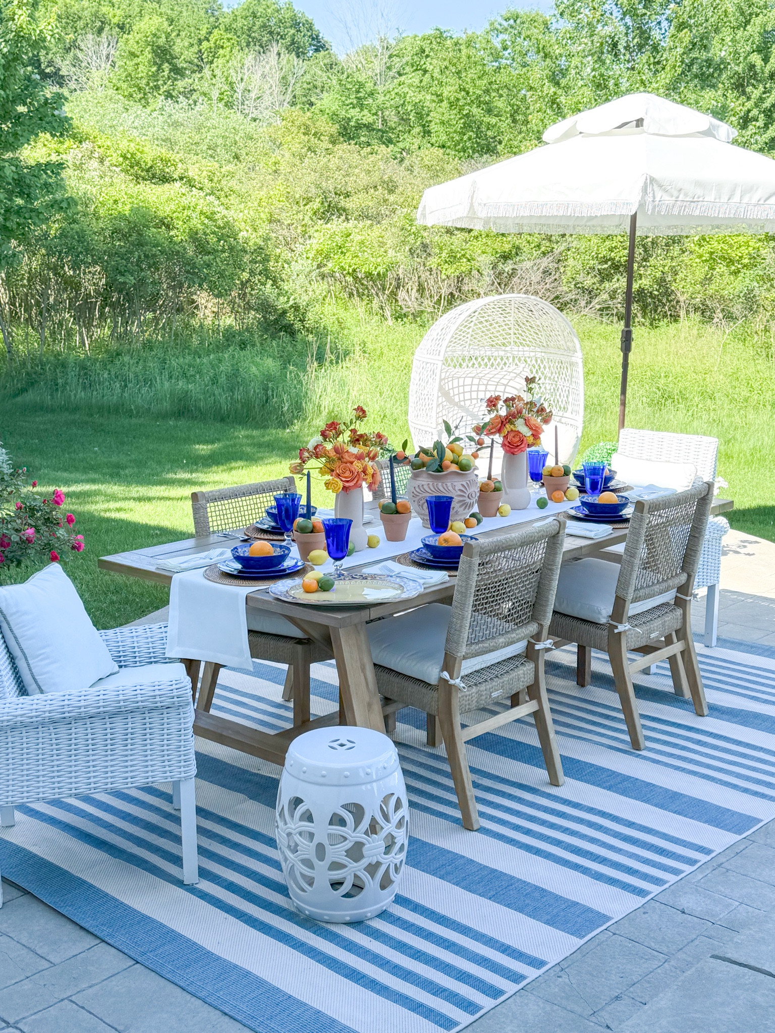 Shop my Tuscany summer tablescape! 

Blue glassware, teak table, outdoor table, outdoor rug, garden stool, fringe umbrella, egg chair, melamine plates, terracotta planter, terracotta vase, summer entertaining 

#LTKSeasonal #LTKParties #LTKHome