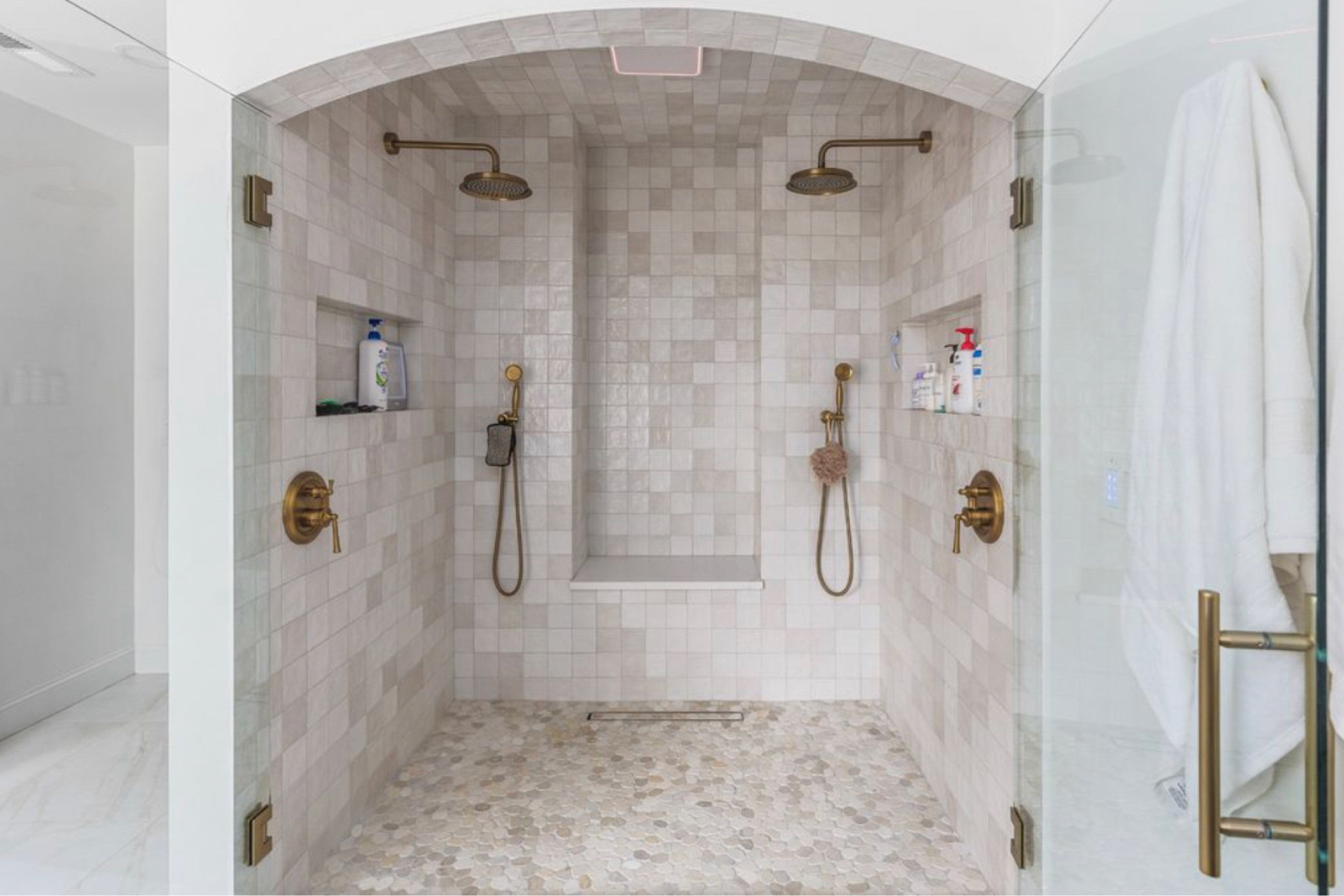 Arched master shower 

Master suite, primary, primary suite, faucets, shower, bathroom, sprayer 

Zelliage white tile, stone floor  

#LTKU #LTKHome #LTKStyleTip