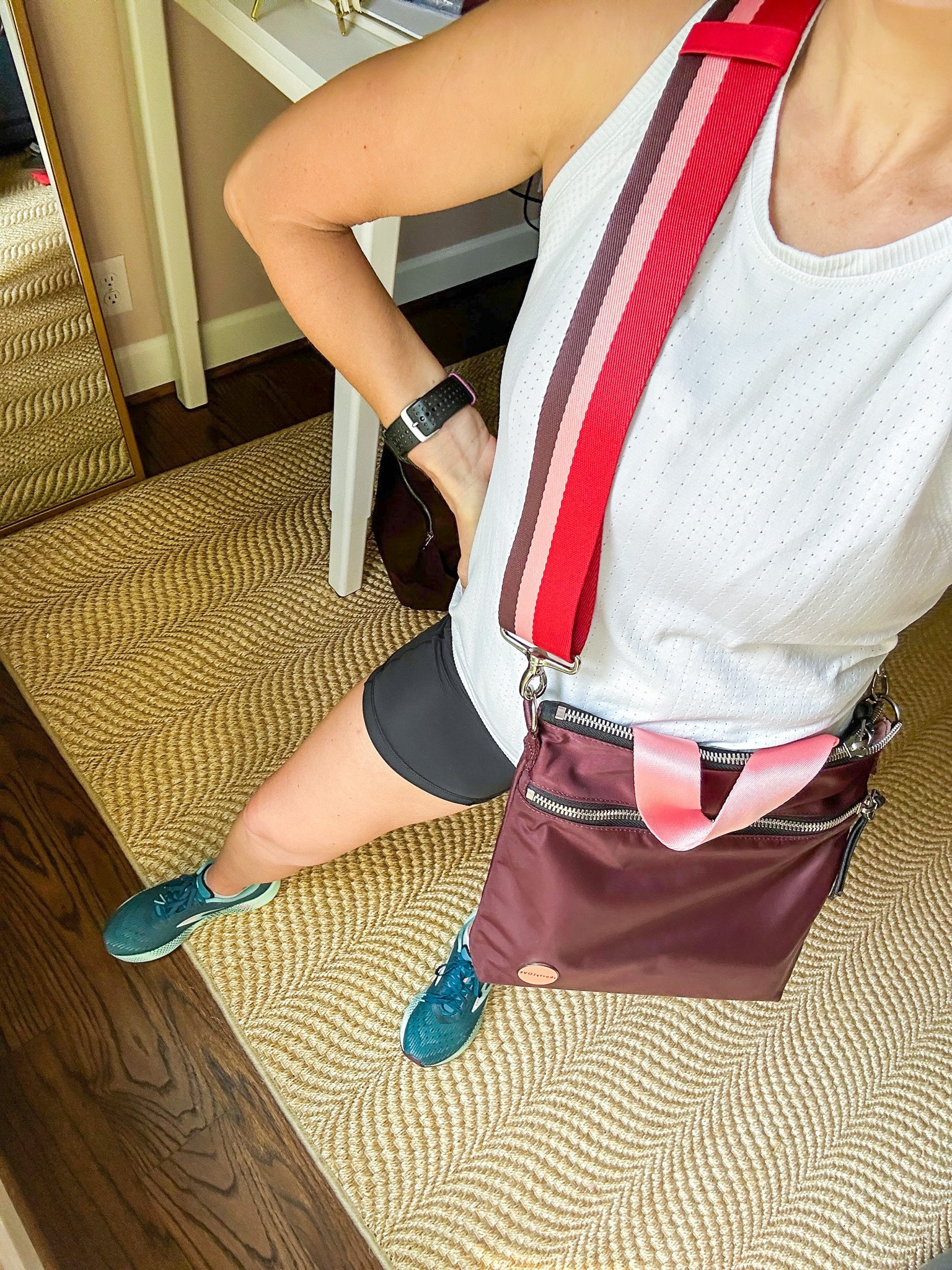 My favorite casual crossbody to throw on with workout clothes: the ShortyLOVE crossbody with the striped boardwalk strap. I love the bright pop of color it adds. This sleeveless workout top is by Athleta and I’m in an XS. My shorts are the Amazon biker shorts that are just like the old Lululemon Fast and Free shorts that aren’t available anymore. I have a size small. My shoes are Brooks and I go up a full size in these. I LOVE them and feel so fast when I wear them.

#LTKfitness#LTKitbag#LTKSeasonal
