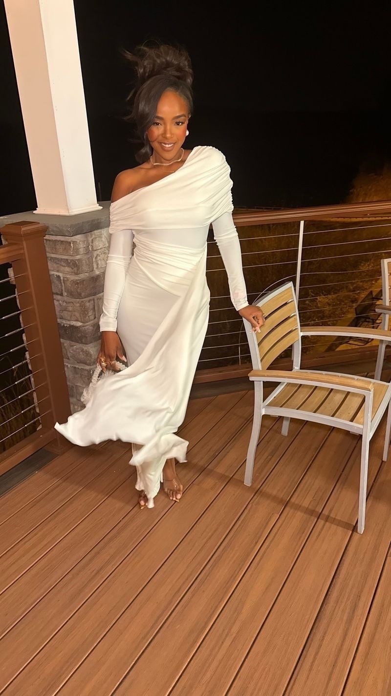 This white one-shoulder dress is pure elegance — soft draping, flattering ruching, and a timeless silhouette that feels elevated without trying too hard. It’s one of those statement pieces that instantly makes the moment feel special.

Perfect for weddings, anniversary dinners, formal events, birthday celebrations, or any evening where you want to feel effortlessly polished.

📏 Sizing & Fit Details  
Height: 5'4"  
Weight: 138 lbs  
Bust: 34D  
Waist: 27"  
Hips: 40"  

Dress: Size Small  

This is a forever kind of piece — style it with minimal heels and delicate jewelry now, then rewear it for future events so the cost per wear keeps dropping over time.

Save this post to come back to it later.

White formal dress, one shoulder dress, elegant evening look, wedding guest outfit, timeless white dress styling

Follow me on Instagram and YouTube @kirasfashionfinds 

#LTKPetite #LTKootd