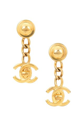 Chanel Coco Mark Turnlock Swing Earrings in Metallic Gold | FWRD 