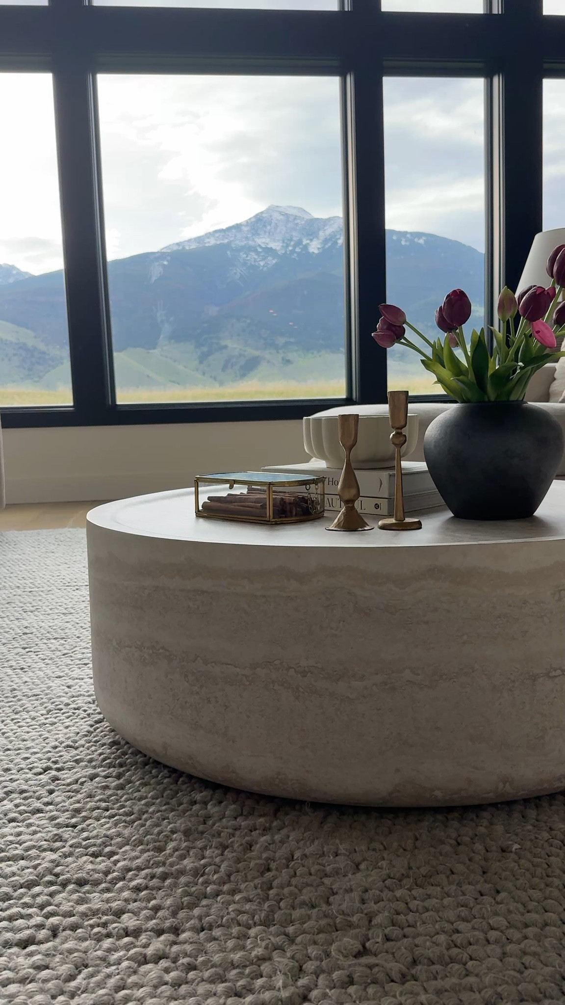 There’s something about this coffee table that grounds the entire space. I love how the soft, round shape pairs with the structured lines of the sofa and windows. One of my favorite pieces in this room.

Follow my shop @rushtonhome on the @shop.LTK app to shop this post and get my exclusive app-only content! Don’t forget to turn on post notifications using the 🔔 to get first dibs! Follow @rushtonhome on Instagram and Pinterest for more home decor inspiration and affordable home finds! Are you looking for anything home related? You’re in the right place! At Rushton Home, I do: home decor, living room, bedroom, affordable, walmart, target, wayfair, new arrivals, winter decor, spring decor, fall decor, fall finds, summer decor, home decor refresh, studio mcgee x target, hearth and hand, magnolia, holiday decor, seasonal decor, dining room decor, bedroom decor, living room decor, affordable home decor, furniture, weekend deals, sale, on sale, pottery barn, kirklands, west elm, bench, foyer table, faux florals, rugs, couches, sofa, sectional, dresser, nightstand, night stand, end tables, lamps, art, wall art, etsy, pillows, blanket, interior design, interior styling, bedding, side tables, bed frame, tray, side table, throw pillows, look for less, designer dupe, budget decor, bar stools, counter stools, vase, ceramic pottery, budget, budget friendly, coffee table, dining chairs, cane, rattan, wood, white wash, rustic, arch, brass hardware, gold hardware, vintage, antique, european inspired, french country, back in stock, living room styling inspo, coffee table inspo 

 #LTKHome #LTKSaleAlert