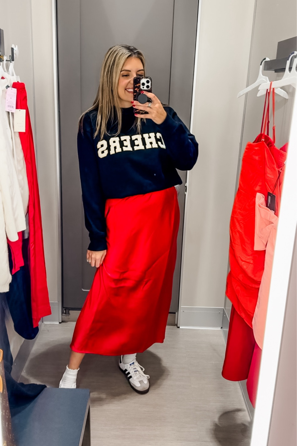 Wearing a size medium in both the sweatshirt and red satin skirt. 

#LTKHoliday #LTKSaleAlert #LTKFindsUnder50