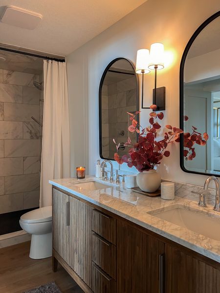 Welcome to our cozy guest bathroom. I wanted this space to feel inviting and warm since it is in our basement.

Target home, bathroom decor, marble bathroom accessories, Loloi runner rug, cloudpile, arched wall mirror, bathroom sconces, amazon home, vanity decor, long white shower curtain 

#LTKhome #LTKstyletip #LTKSeasonal