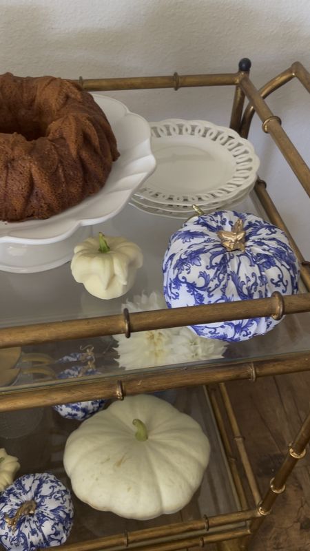 Blue and white pumpkins. Cottagecore fall decor. Fall bar cart. Blue and white Halloween decor. Homegrown pumpkins. White stacker pumpkin seeds. White Daisy gourds. Nordic Ware fall bundt cake pan. White cake stand. Blue hobnail glasses. Gold bar cart decor. Amazon home. An Amazon finds. Pottery Barn home. Pottery Barn finds. Williams Sonoma home. Williams Sonoma finds. 💙🤍💙 

#LTKunder50 #LTKhome #LTKSeasonal