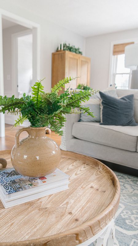 Living room, coastal style home decor, ceramic vase, artificial fern, round coffee table, sofa, decorative throw pillows

#LTKfamily #LTKhome