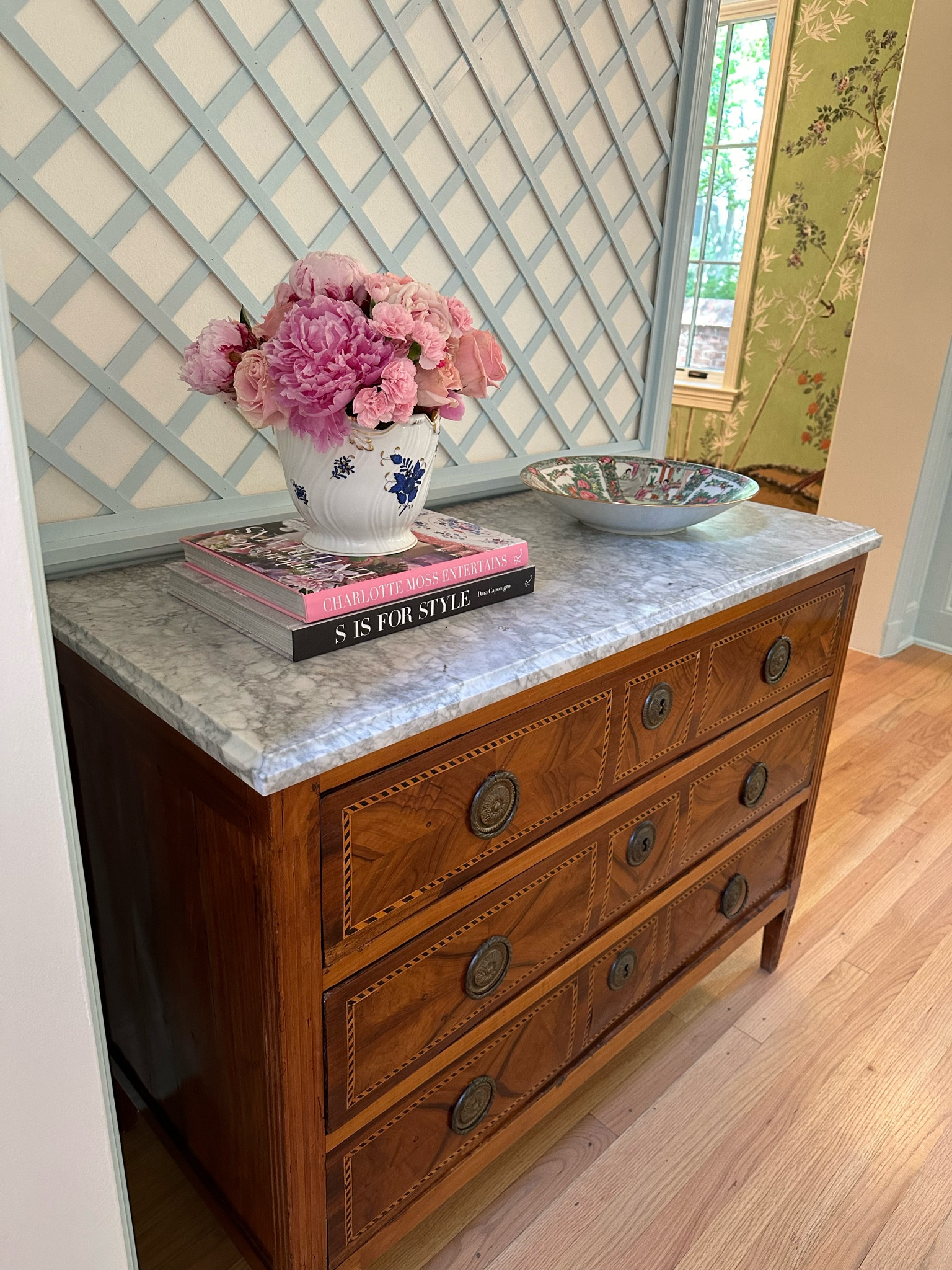Entry way update! Just got in this chest from a local Dallas shop rare antique piece. I found some more similar you can shop online for. I have been wanting a chest with a marble top and have to decorate it since it’s end of peony season with a few of my favorite pieces. Linked what I could and similar rose medallion bowels - always love that pop of color in them in any room! Rose medallion, porcelain, coffee table books, entry way styling, trellis design, chinoiserie, traditional with a twist, interior design 

#LTKHome