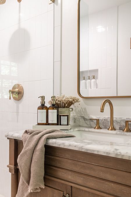 Bathroom vanity styling 

bathrooms; neutral home; vanity; brass fixtures 

#LTKhome #LTKfindsunder100 #LTKfindsunder50