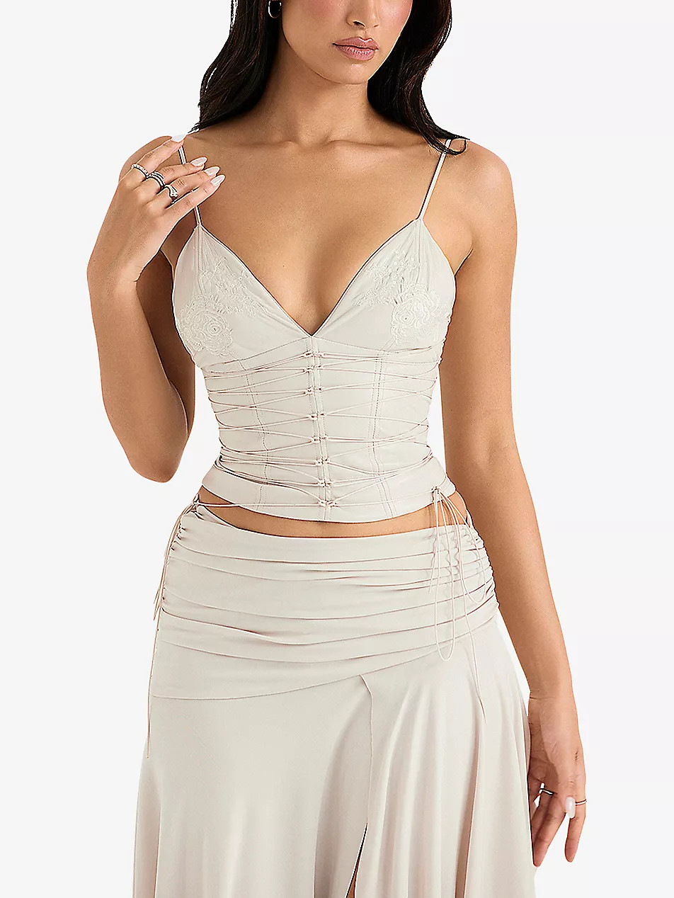 Antonella strap-detail vegan faux-leather corset | Selfridges