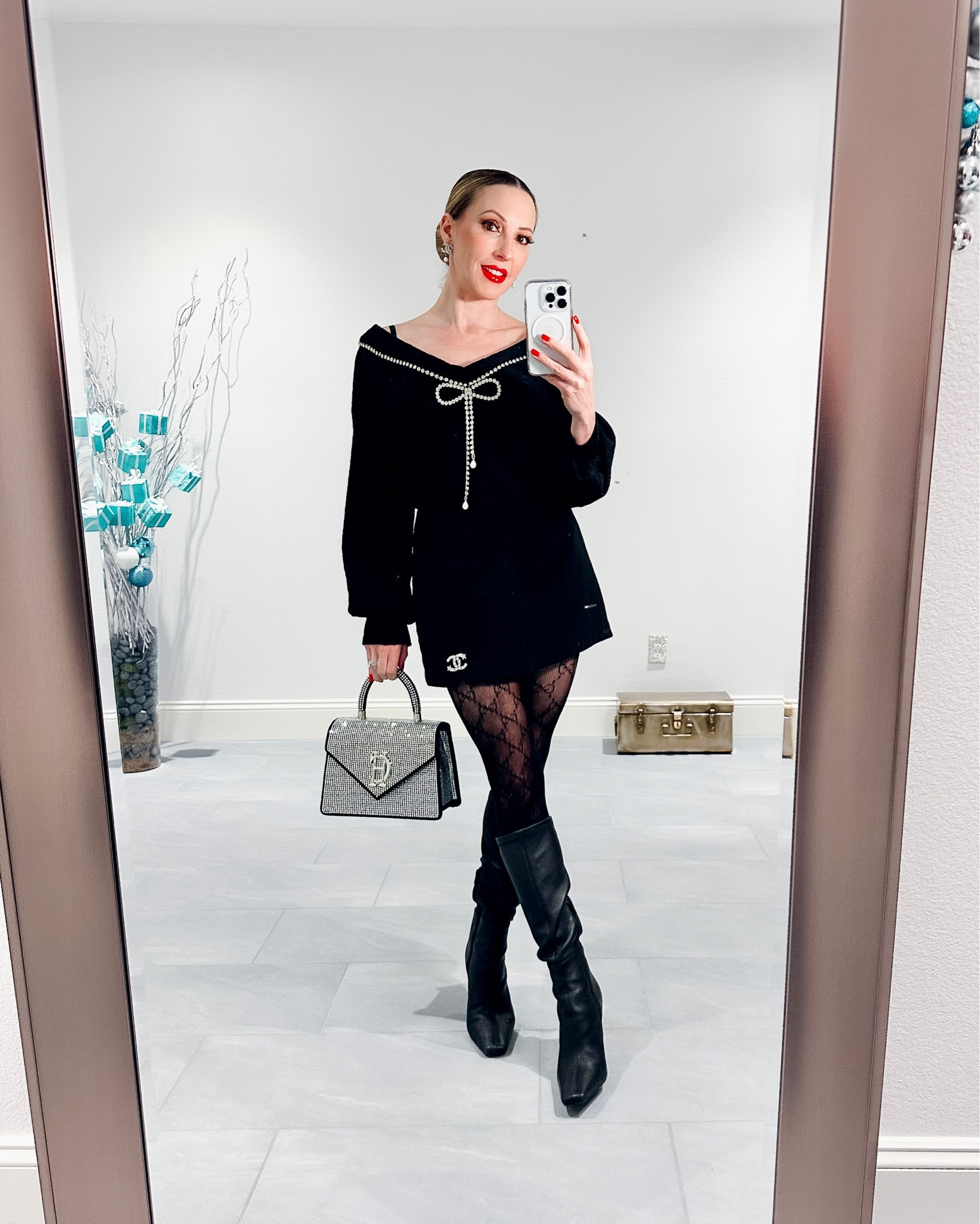 Black Gucci logo tights back in stock! Cozy winter outfit, Thanksgiving outfit, holiday outfit : reversible black sweater with crystal bow detail can be worn on or off the shoulders, designer tights, black knee high boots, vegan red lipstick 

#LTKbeauty #LTKSeasonal #LTKCyberweek