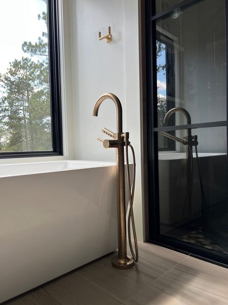 Primary bathroom. Brizo tub filler and the towel hook is from RH. The tub no longer is being made but I will link similar items. #misaliddiard #theforestdwelling

#LTKstyletip #LTKhome #LTKfamily