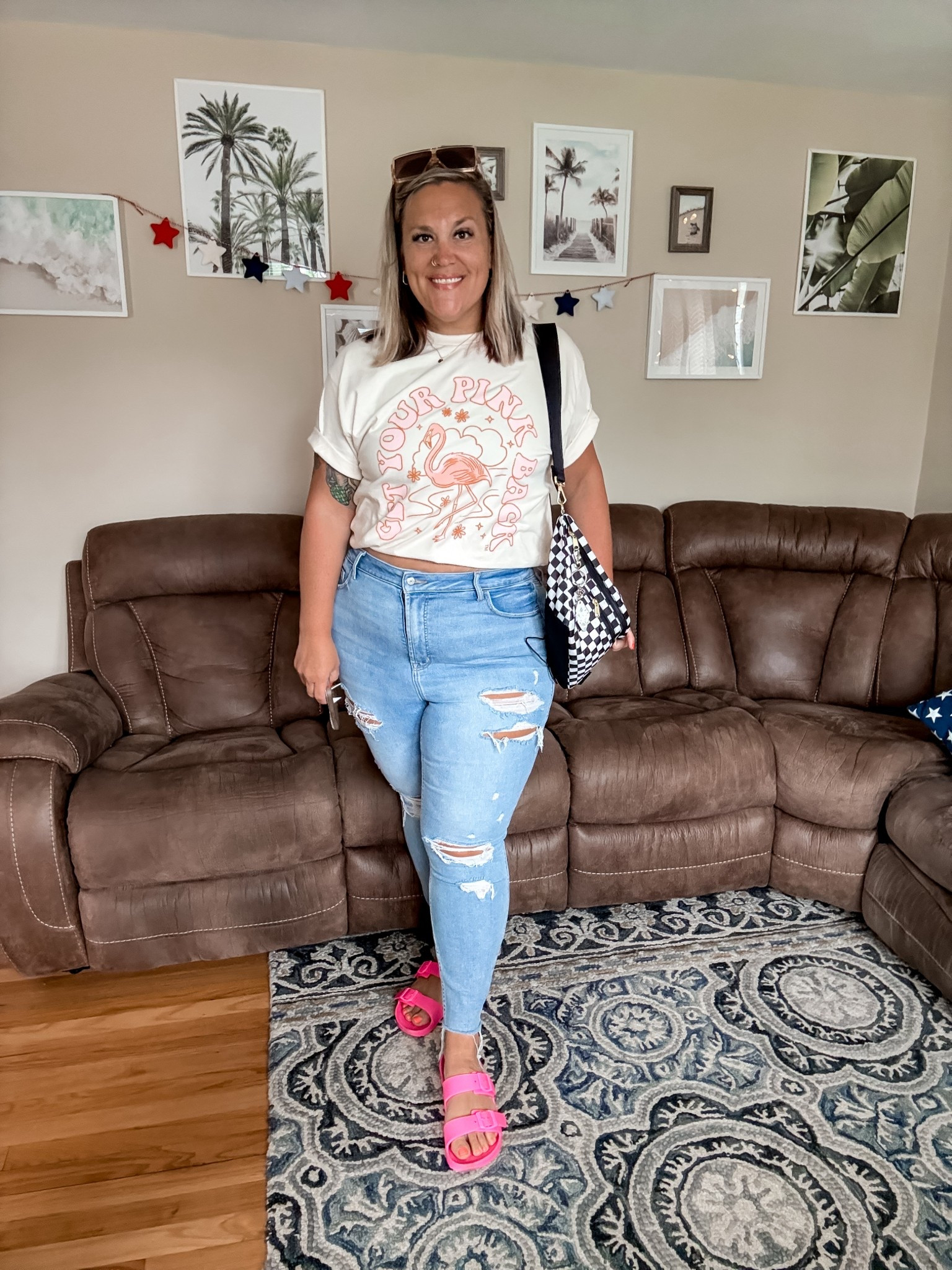 GRWM as a combo SAHM / social media manager who’s “going into the office” today ☺️

workout ☑️
shower ☑️
eat and caffeinate ☑️
get kids fed ☑️
pack lunches ☑️
blow dry the sweat out of my hair ☑️
straighten up kitchen ☑️
get dressed for the day 🦩

outfit deets:
• my new @gypbshop T-shirt (natural color) is so soft and comfy. wearing XL and def oversized!
• too-big (thanks @thehabyt + @kristencraft_np) ripped skinny jeans are vintage Old Navy
• @analuisany earrings and necklace stack
• 🖤🤍 checkered oversized @canvelle fanny
• target neon pink slides
• bra is @harperwilde bliss racerback bralette and absolutely 10/10

#LTKStyleTip #LTKPlusSize #LTKMidsize