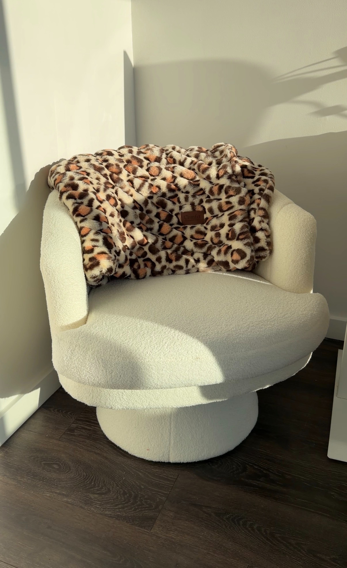My new favorite cozy corner setup. The boucle swivel chair is so comfortable, and this leopard blanket feels like an absolute cloud. Perfect for lounging at home. 

 #LTKHome