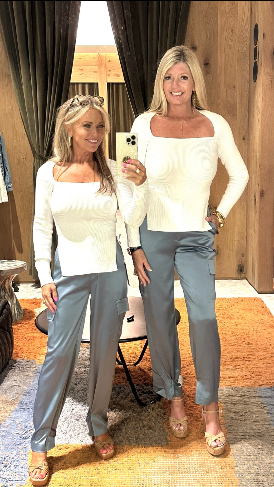 Lori is wearing a XS in the Top and a size 25 in the Pants. 
Leslie is wearing a Medium in the Top and a size 29 in the Pants  