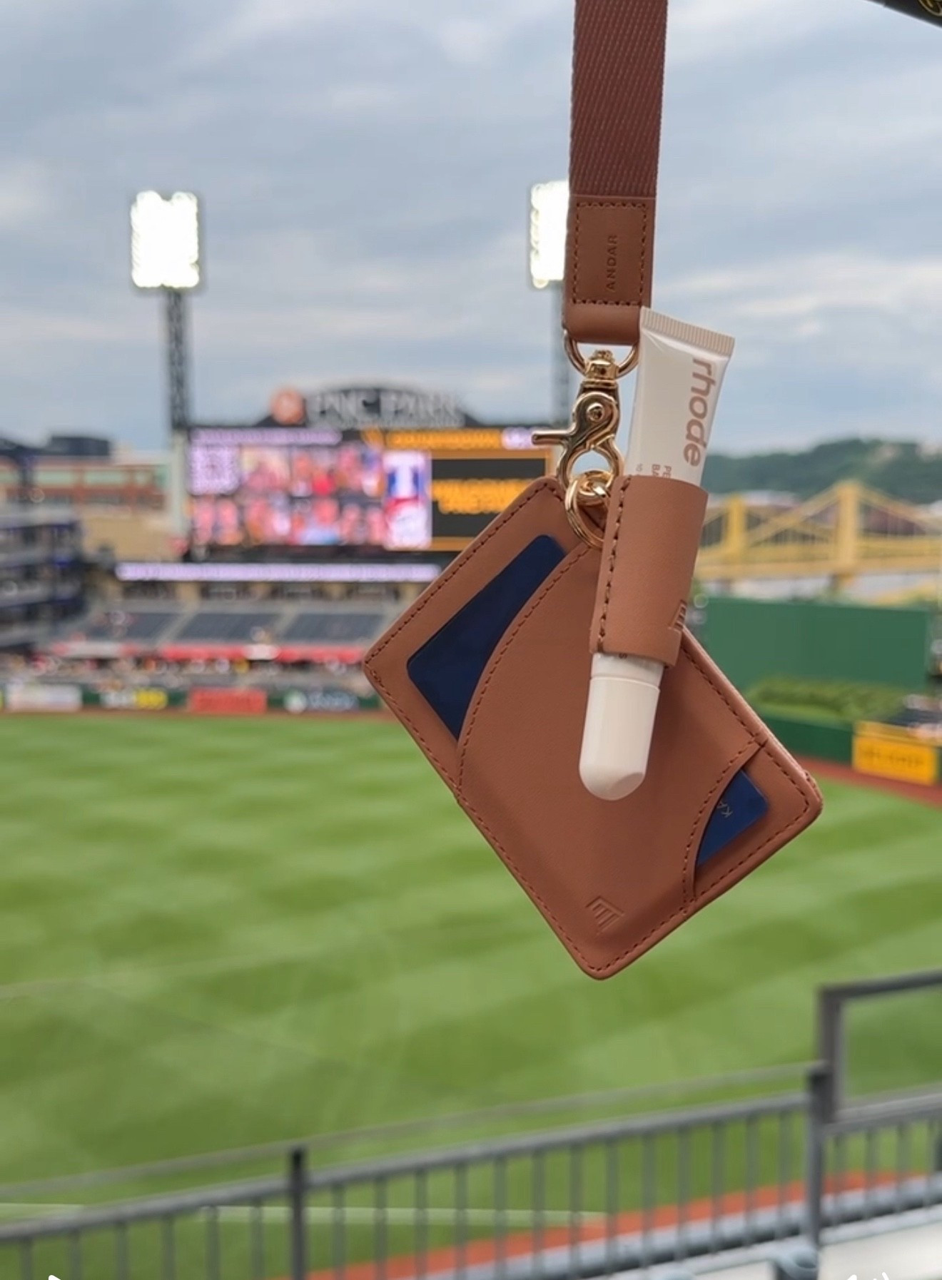 this cooler weather has me wanting to get back to a baseball game! if your ball park is like mine then you probably have bag restrictions. instead of using a clear bag, I just grab my favorite wristlet from Andar and attached a chapstick holder for my lip gloss! 

#LTKItBag #LTKSeasonal #LTKFindsUnder100