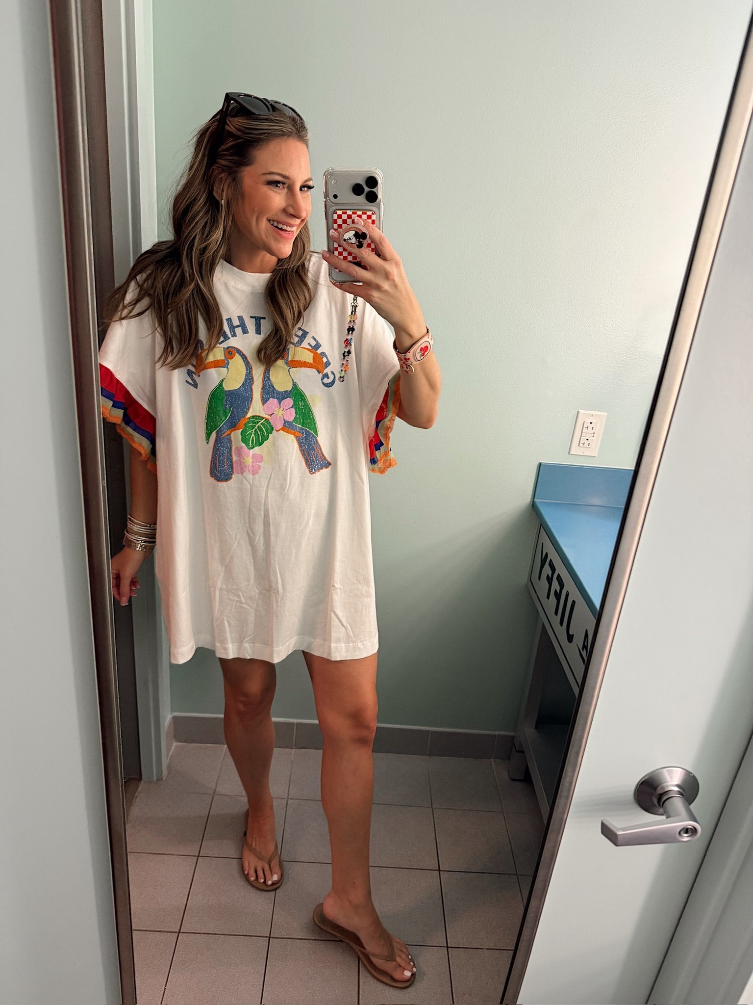 In a medium oversized t-shirt dress I’m wearing as a swim coverup, sandals and accessories - fits tts.