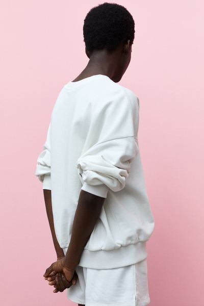 Relaxed-fit sweatshirt in a cotton blend with a washed look. Dropped shoulders, long sleeves, and... | H&M (US + CA)
