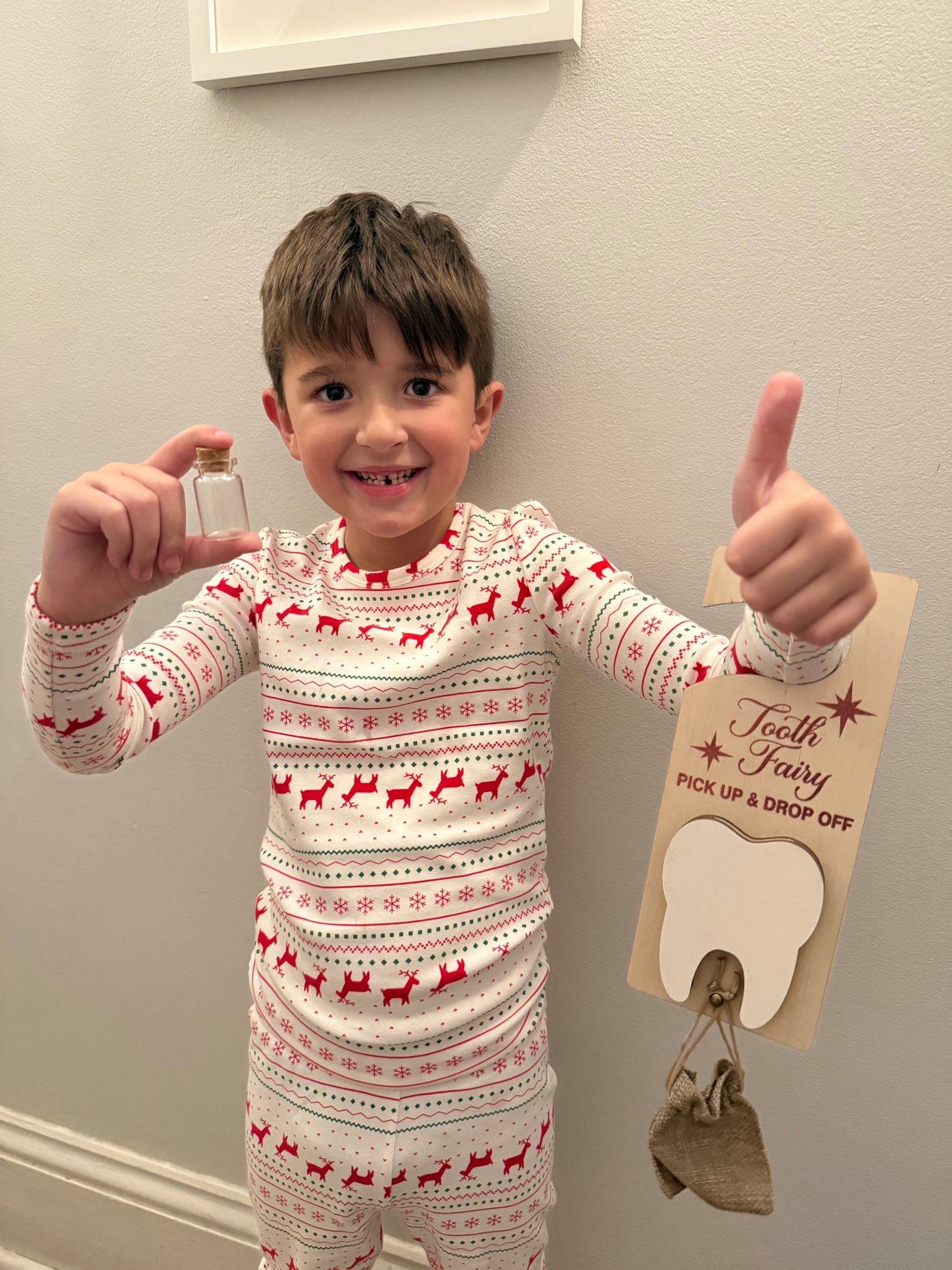 our little man lost his first tooth!! 🦷 so glad that i has this tooth fairy door hanger ready to go!

#LTKKids #LTKFindsUnder50 #LTKmomlife