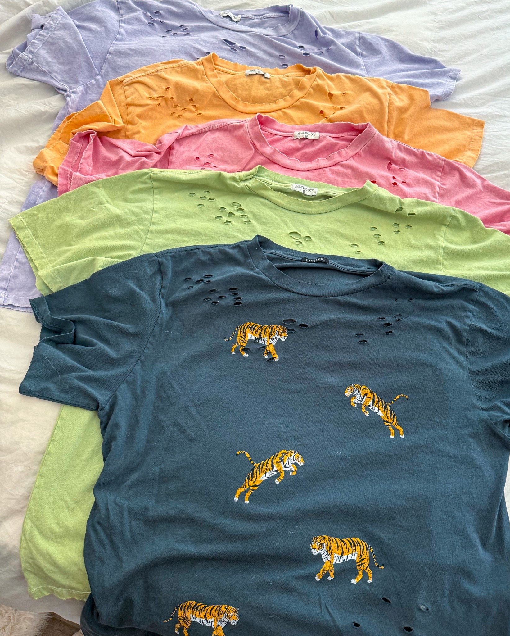 My FAVORITE place to grab oversized tees, especially distressed ones with fun prints & vibrant colors! 💜🧡🩷💚

#ThePost #ShesAPostie #Spring #Colorful #Tiger #Neons #OversizedTee #DistressedTees #Sale 

#LTKFindsUnder50 #LTKStyleTip #LTKSpringSale