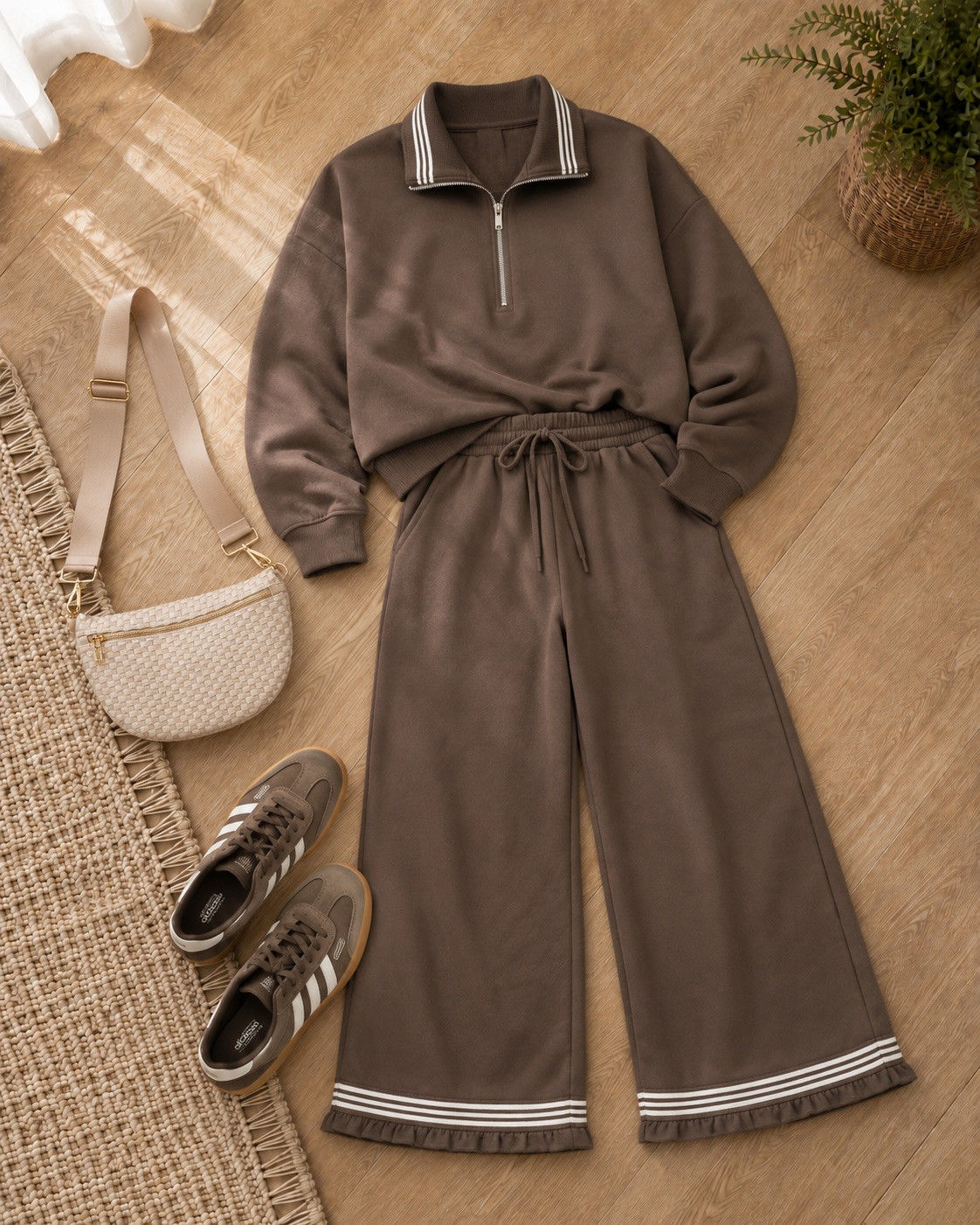 Athleisure that feels elevated! This chocolate-brown matching set is so cozy, with the striped quarter-zip collar and those fun ruffle-hem wide-leg pants. Add gum-sole sneakers and a woven belt bag to keep it casual and cute. Perfect for travel days, coffee runs, or comfy errands around town! 

 #LTKmomlife #LTKSeasonal #LTKActive
