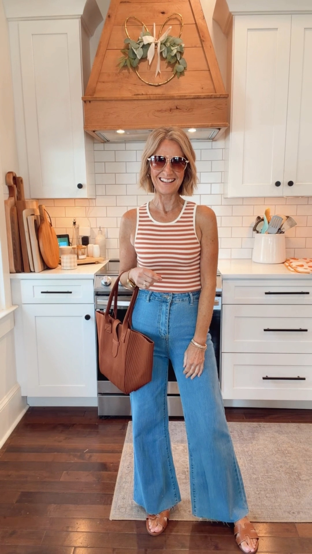 Loving the retro vibe of this look! Striped tank + high waisted wide leg jeans is such an effortless combo. Comfortable, flattering, and perfect for everyday.  Wearing a small.  

#LTKOver40 #LTKSpringSale #LTKootd