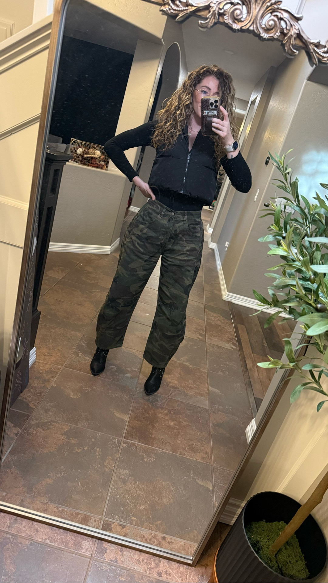 The mix I keep coming back to lately.
Fitted black zip + wide-leg camo + ankle boots. 

#LTKdayinmylife #LTKgrwm #LTKWorkwear