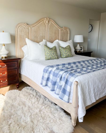 Oversized white linen quilt king bedding with blue and white gingham checkered muslin gauze king sized throw blanket. White euro shams. White and gold bedside table lamps. Sheepskin rug. 

Grandmillenial, French country, classic style, primary suite 

#LTKhome