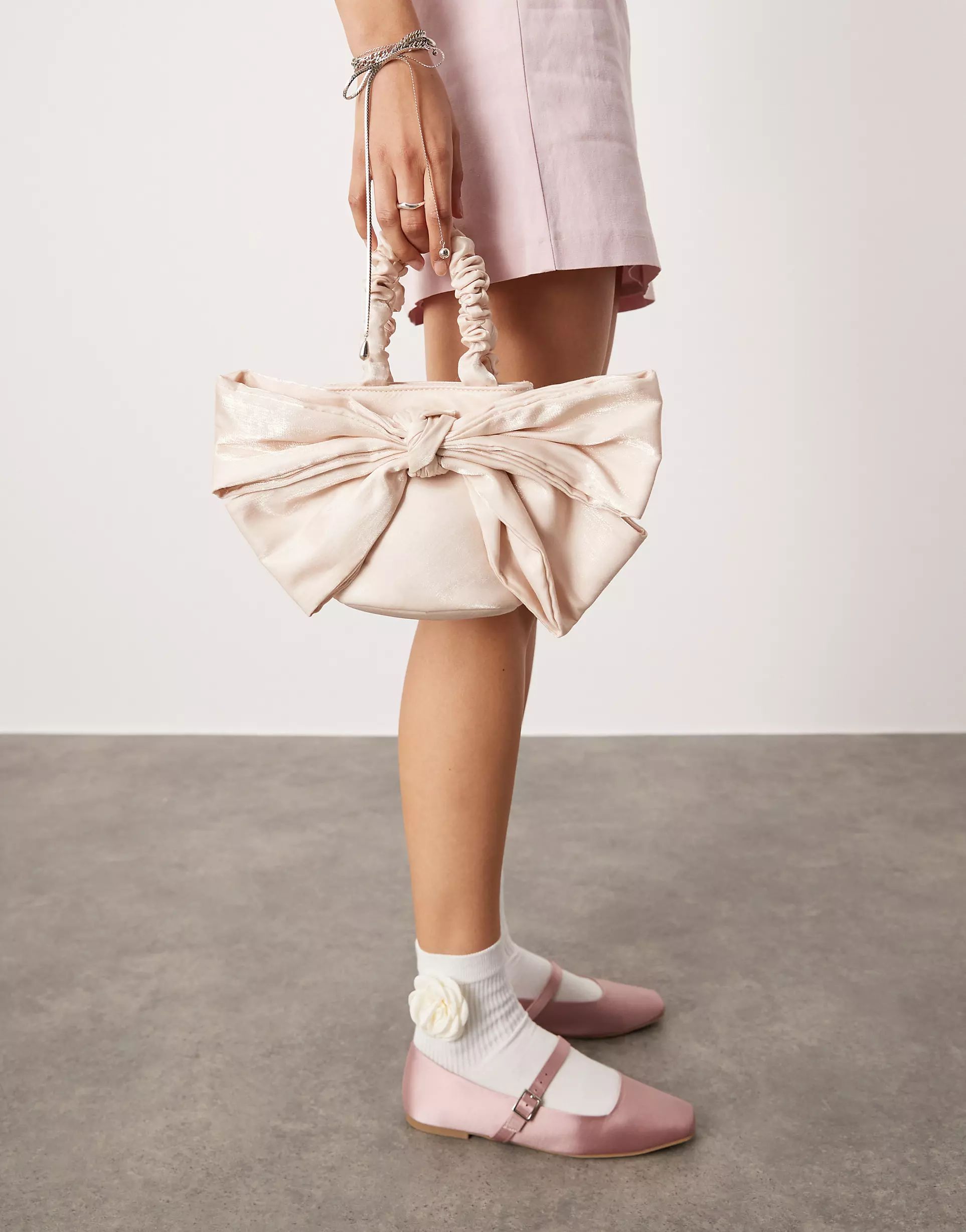 ASOS DESIGN oversized bow bag in pink | ASOS (Global)
