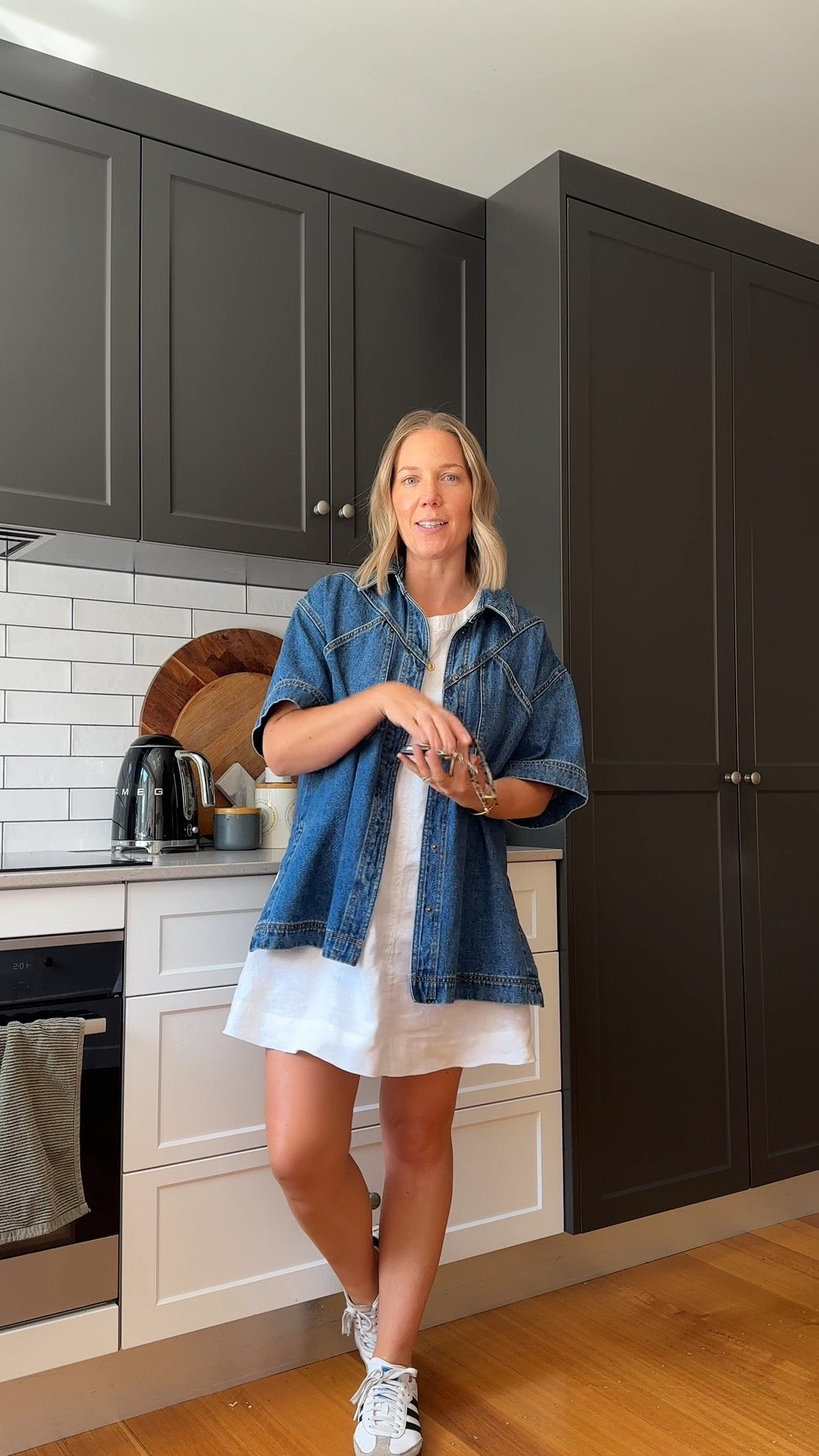 Layering my favourite denim shirt over a white linen dress for a casual Thursday. Wearing a size 10 in both.