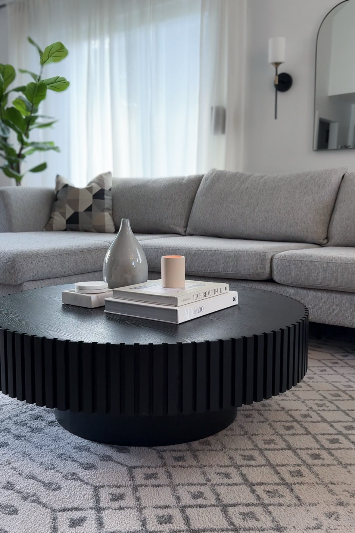 Living room details 🖤✨

Modern organic decor, coffee table, black coffee table, round coffee table, sectional couch, grey couch, living room design, living room area rug, amazon home, designer or dupe, save vs splurge 

#LTKHome