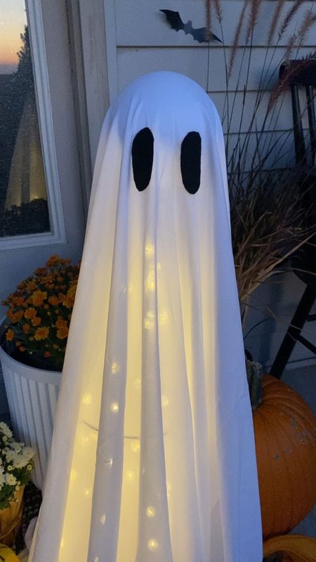 DIY ghost decor // tomato cage, zip tie, styrofoam ball, white sheet, string lights, black felt for eyes 

#LTKHalloween #LTKhome #LTKSeasonal