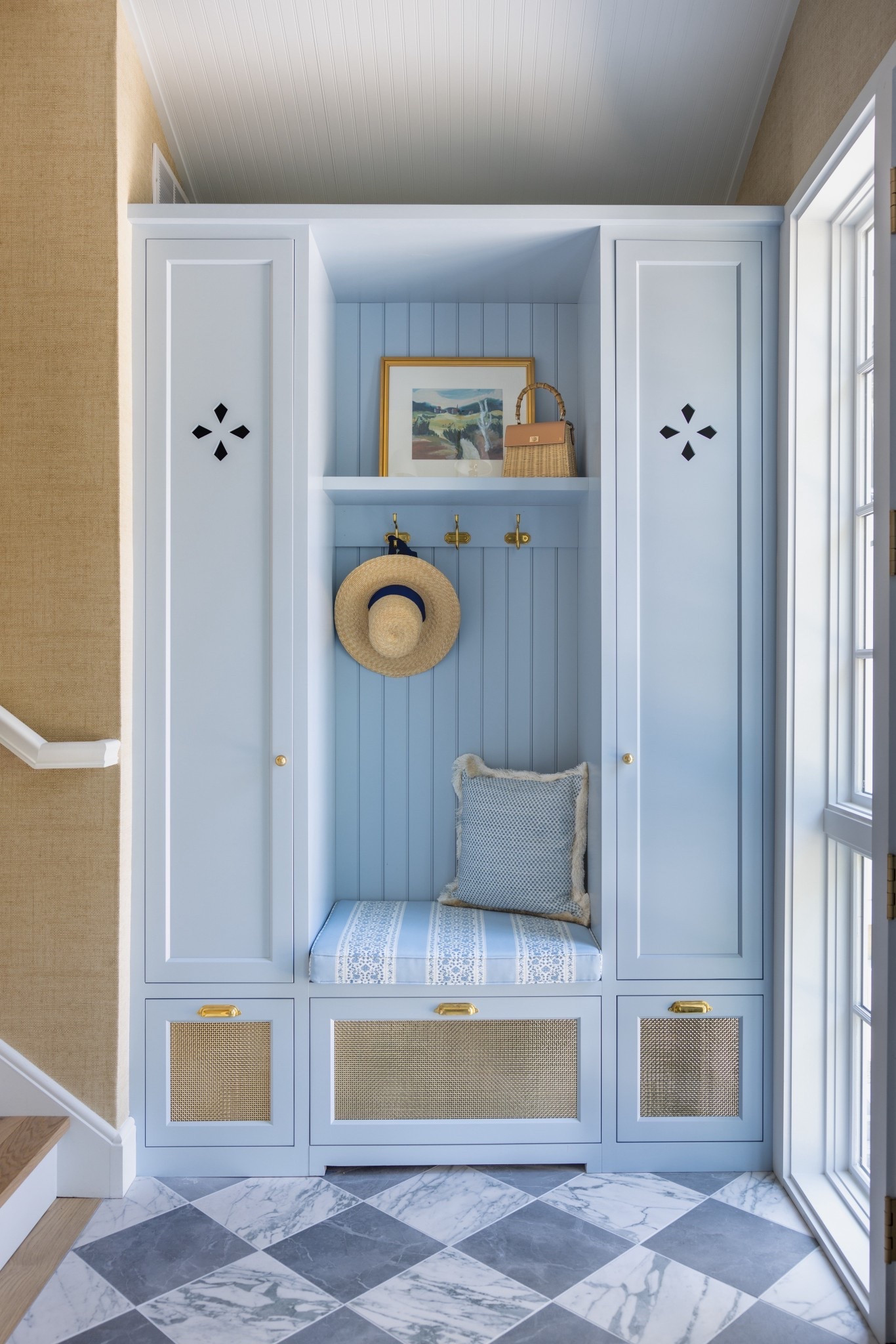 Our front entrance at the lake home makes me so happy! We worked with our interior designer to create two custom built-ins that flank our front entrance. So helpful for storage and seating. 

#LTKHome #LTKSeasonal #LTKstorytime