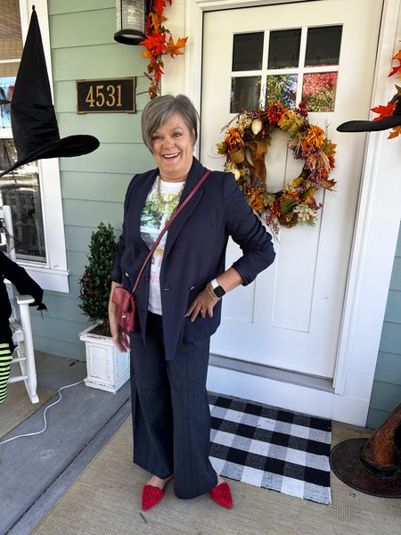 Navy blazer, graphic tshirt and wide leg pants. Red flats and red crossbody bag! Holiday outfit #fashionover50 #classicstyle #widelegpants #redflats 

#LTKstyletip #LTKshoecrush #LTKHoliday