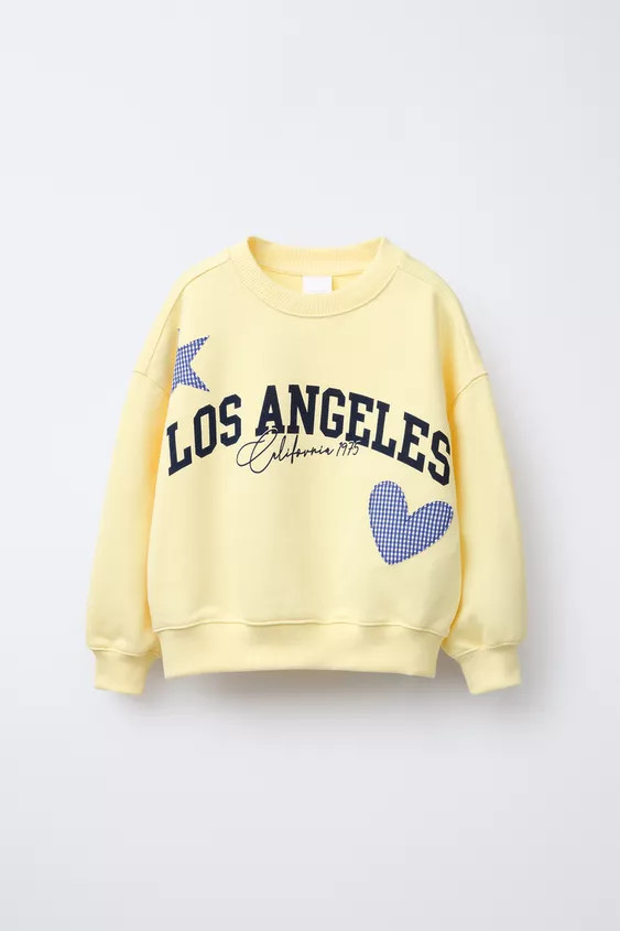 Crew neck sweatshirt with long sleeves. Ribbed trim. Front text print and gingham print patches. | Zara US
