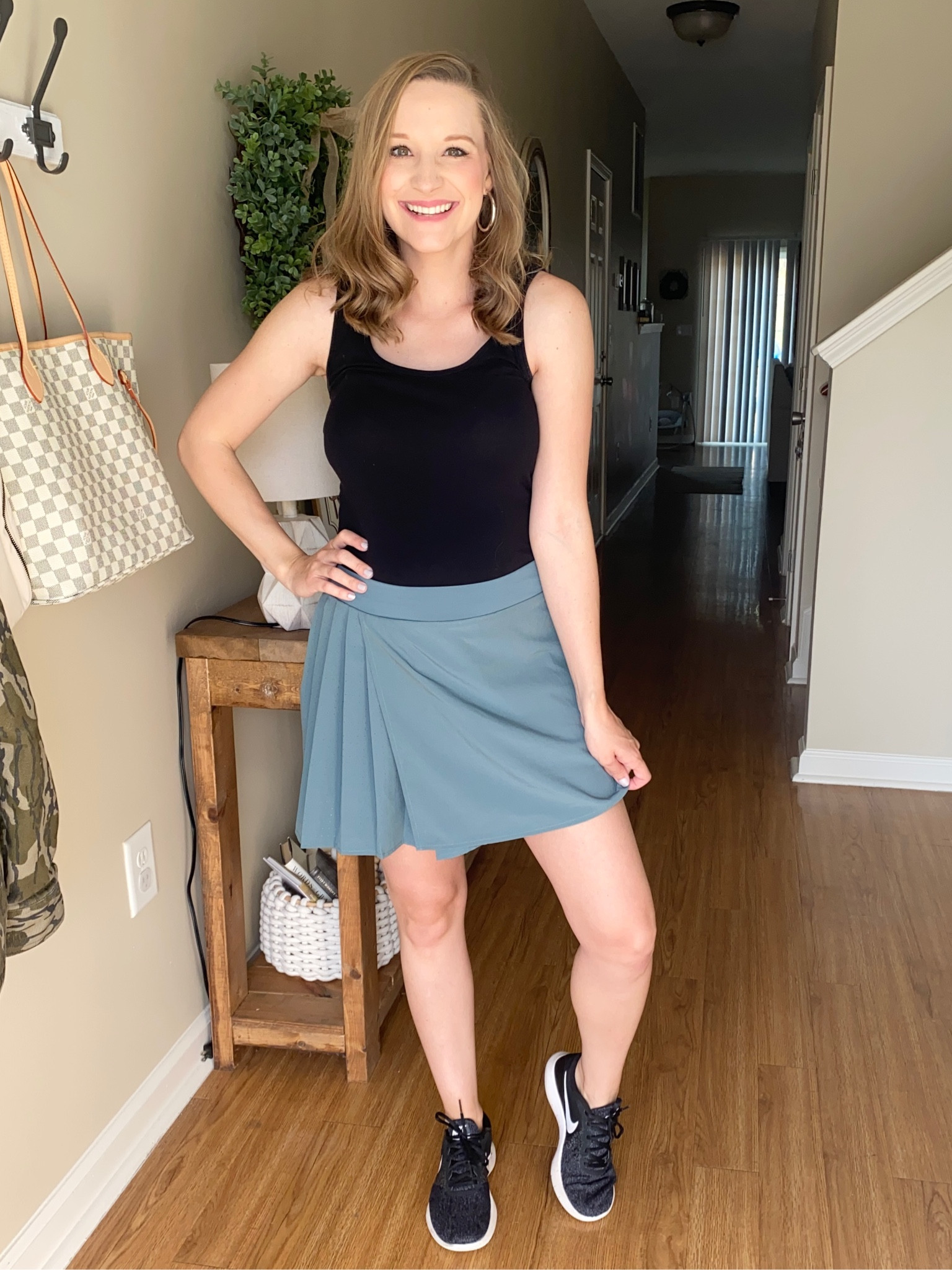 Walmart athletic skort under $13 paired with a black athletic tank top and black Nike tennis shoes!! 

#LTKfitness #LTKshoecrush