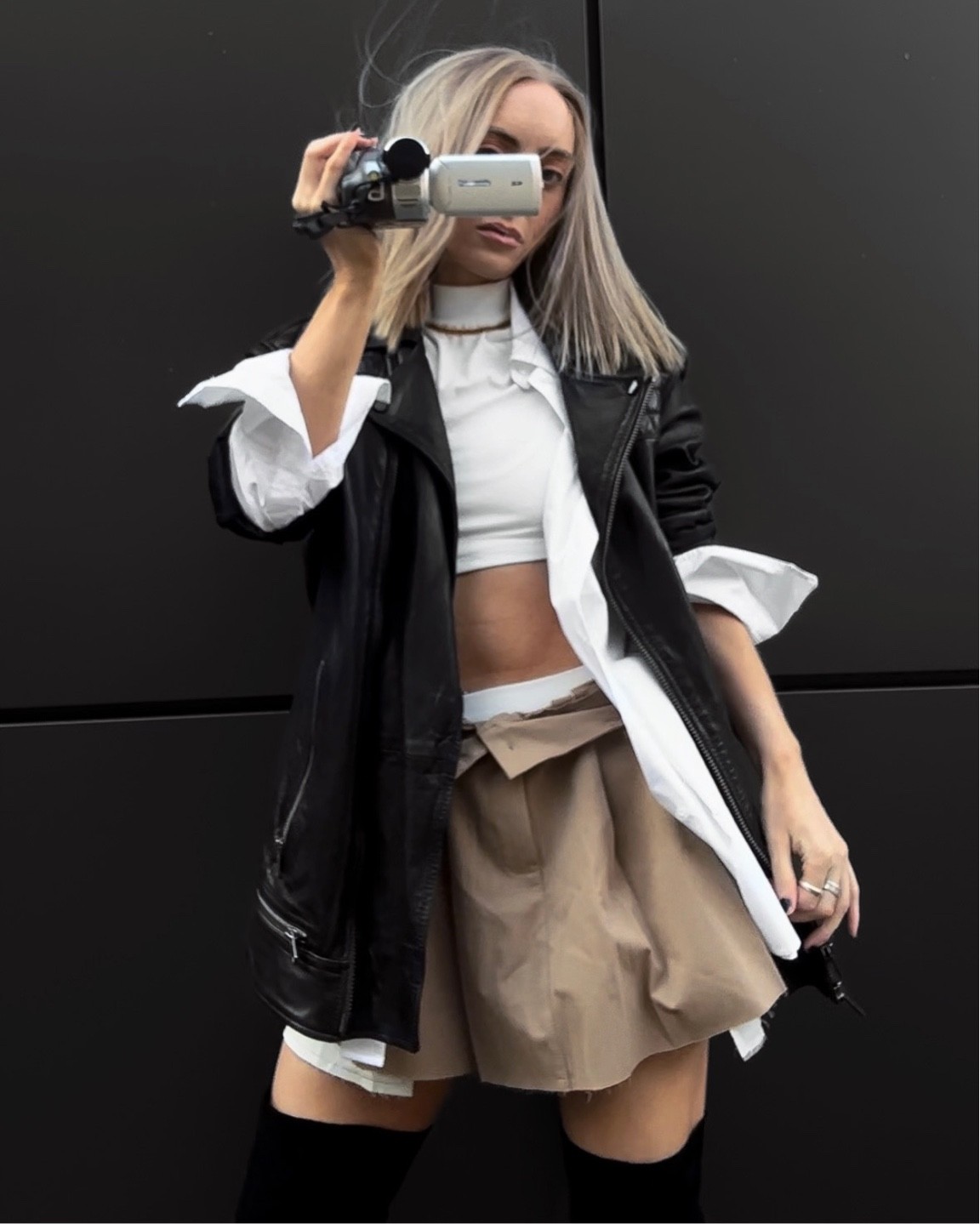 Khaki pleated Mini skirt + Boy shorts paired with over the knee boots & an oversized leather jacket 🫶🏼

#LTKstyletip #LTKshoecrush #LTKSeasonal