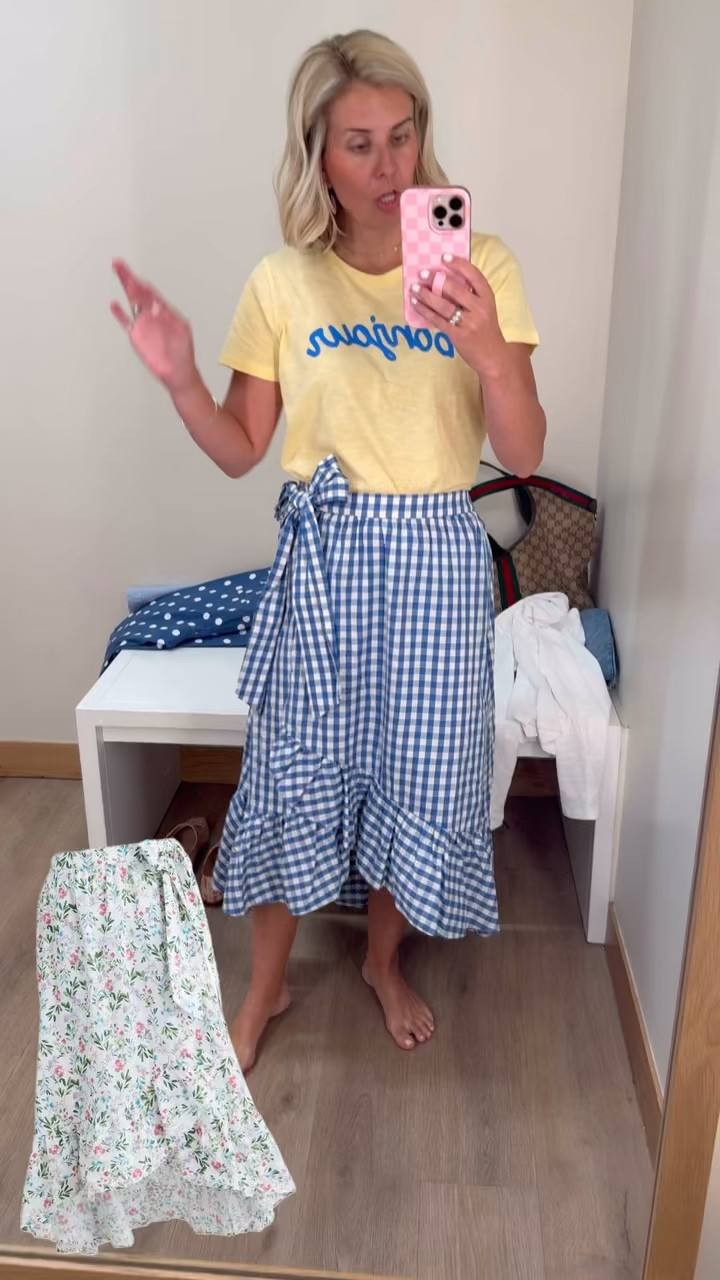 This wrap skirt is such a yes!! We are styling this all the ways yall. How cute would this be with a crisp, white blouse & a heel? I’m wearing a small in the tee and skirt. ￼

#LTKSeasonal #LTKdayinmylife #LTKSaleAlert