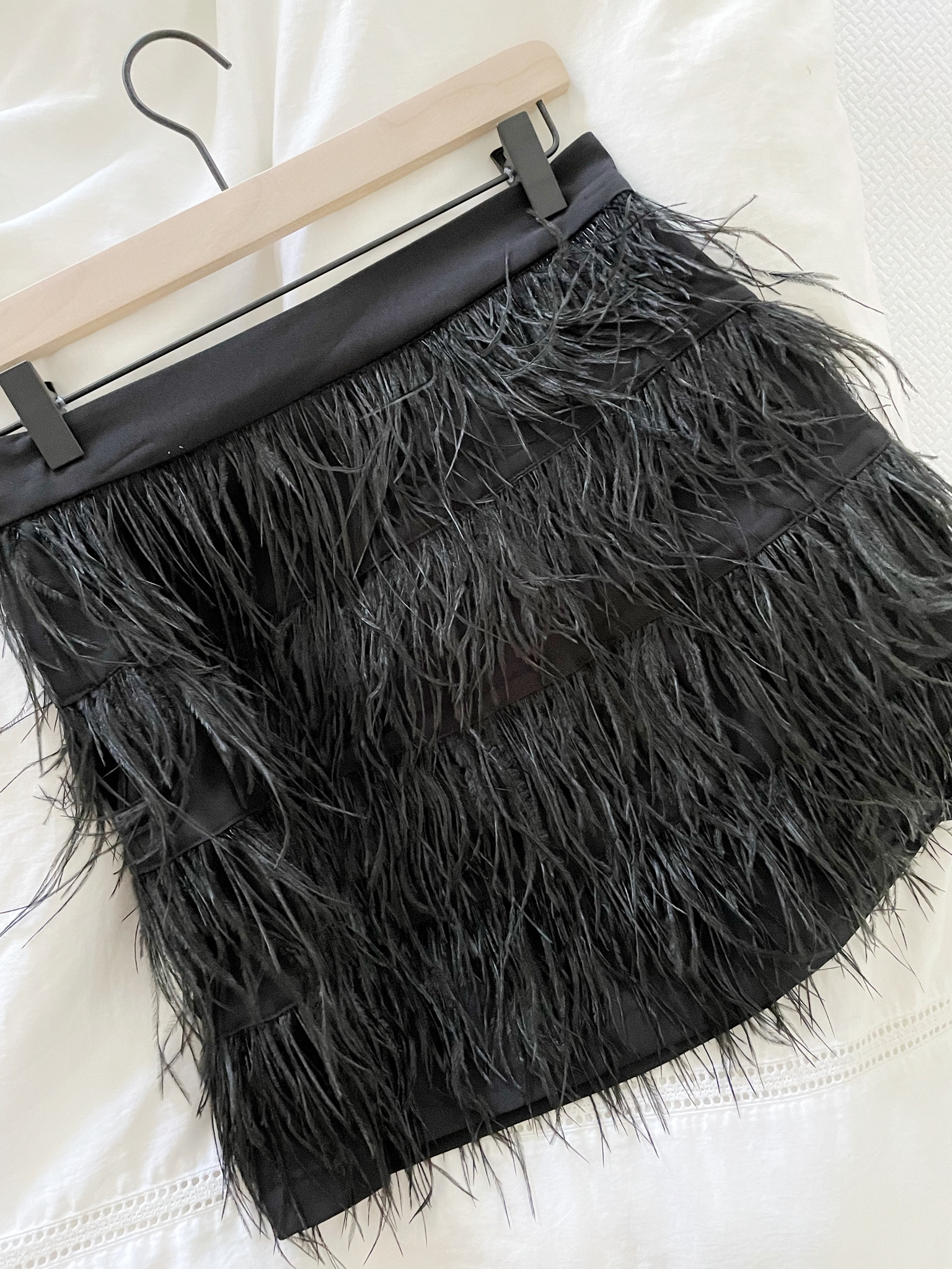 A favorite feather mini skirt of mine is fully stocked and just marked down! I love pairing with a turtleneck, semi-sheer tights and booties. I have in size small

#LTKsalealert #LTKSeasonal