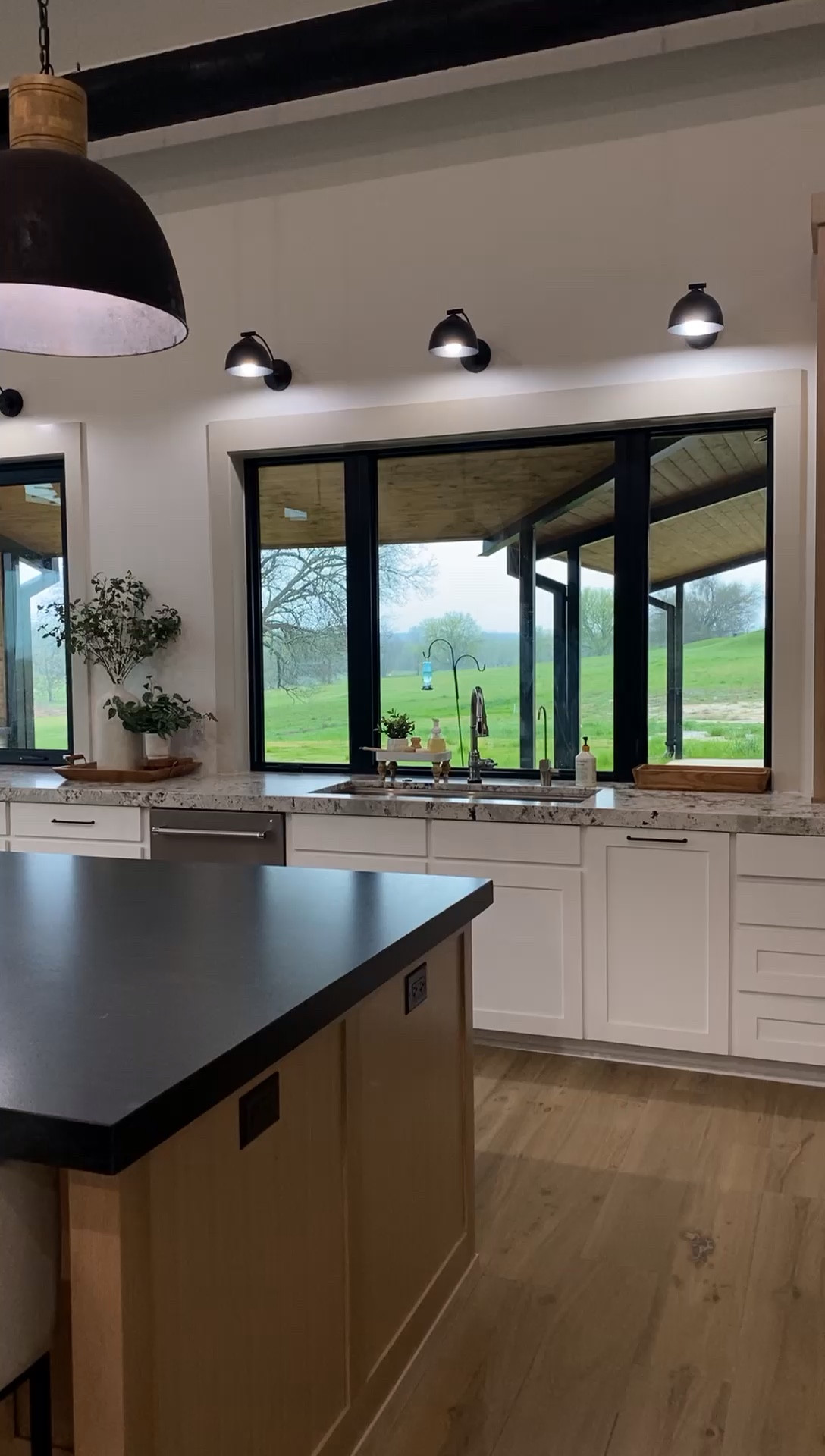 Modern barrel shaped upholstered countertop height bar stools make this kitchen amazing  

#LTKhome #LTKVideo
