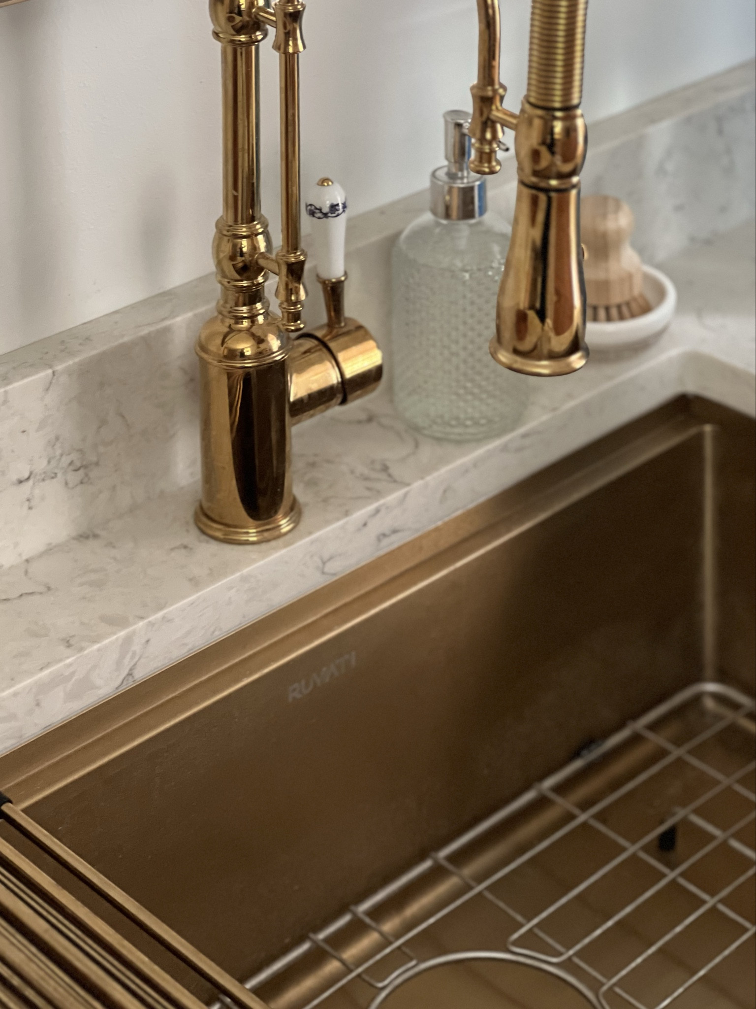 Looking to renovate your kitchen or butler's pantry? You can't go wrong with a brass sink and a polished gold high arc faucet. What a beautiful combination against the quartz countertop! 

#LTKSaleAlert #LTKmomlife #LTKHome