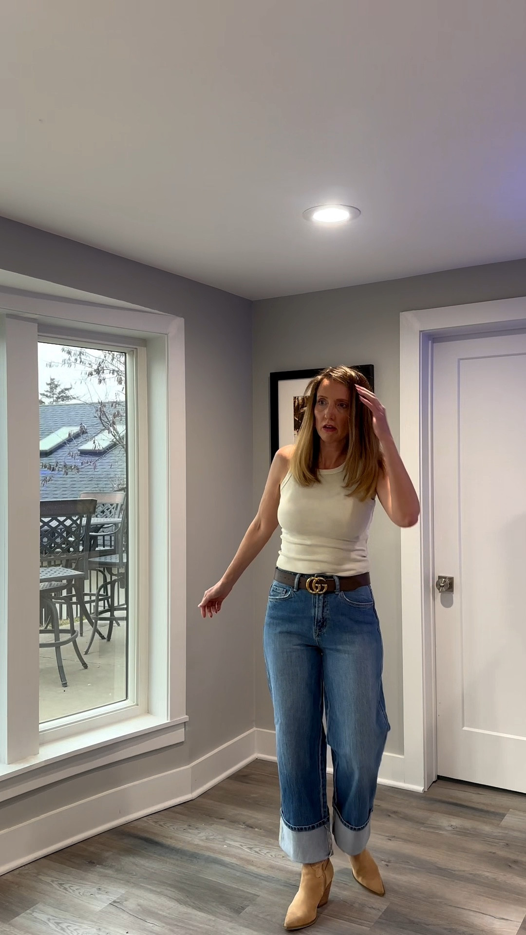 Switching things up with a simple ribbed tank and these must-have wide-leg jeans. 🐚👖 There is nothing like a neutral base and a classic leather belt to make a casual afternoon feel a little more elevated. Tap the link in my bio to shop this exact look and my favorite everyday accessories! ✨ #NeutralOOTD #CasualStyle #DenimDetails #ShopTheLook @VICI 

My Effortless Neutral Style Breakdown
• The Top: I’m wearing a classic cream-colored ribbed tank top with a high neckline, providing a sleek and versatile foundation for the outfit.
• The Denim: I’ve paired the top with medium-wash, wide-leg jeans featuring an eye-catching, extra-deep cuff at the bottom to add a modern edge.
• The Accessories: I’m styling the look with a wide, dark brown leather belt to add structure and a touch of classic detail to the waistline.
• The Footwear: I finished the look with tan suede heeled booties, which perfectly complement the warm, neutral tones of the top and belt.
• The Vibe: This is the definition of "polished casual"—it’s a simple combination that feels high-end thanks to the exaggerated denim cuffs and rich leather accents.
Cream ribbed tank, cuffed wide leg jeans, medium wash denim, dark brown leather belt, tan suede booties, heeled ankle boots, casual spring outfit, everyday chic style, minimalist fashion, relaxed denim look, LTKstyle

#LTKootd #LTKOver40 #LTKmomlife