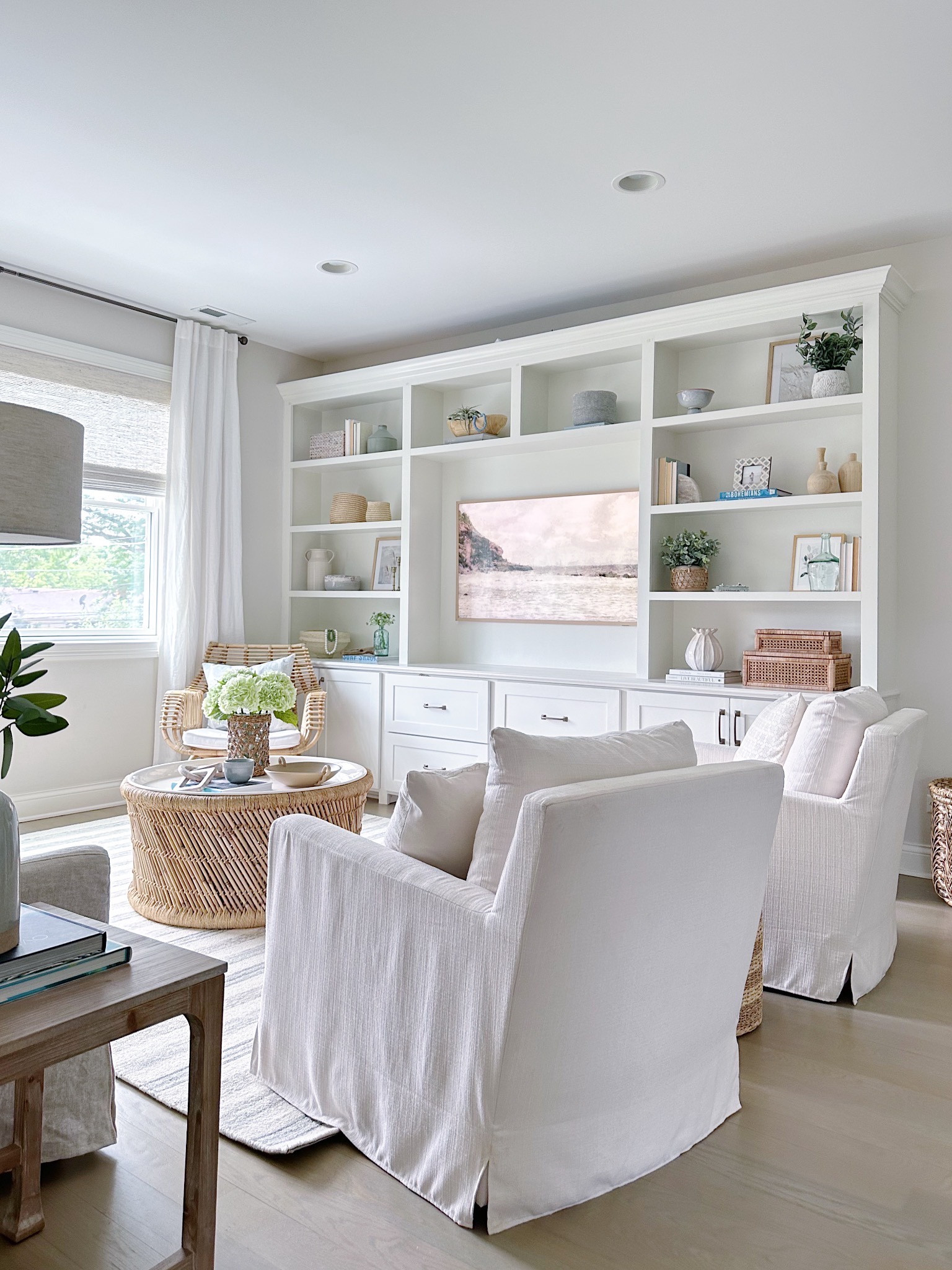 Sitting room, sitting area, small living room, accent chair, accent chairs living room, white accent chair, comfy chair, chairs living room, living room chair, arm chair, living room accent chair, round coffee table, rattan coffee table, living room rug, neutral area rug, (8/20)

#LTKFind #LTKstyletip #LTKhome