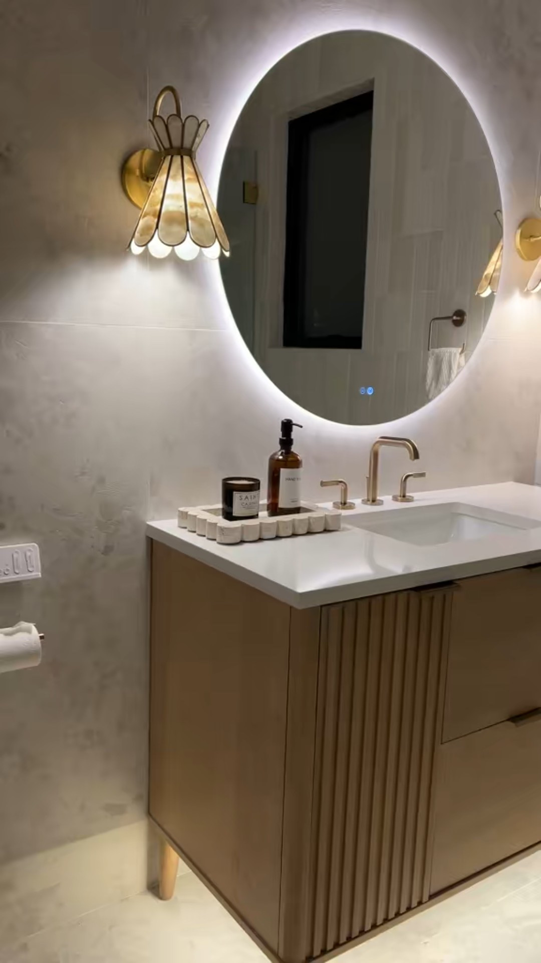 Scalloped  capiz sconces, Reeded vanity, subway tile and champagne bronze fixtures equals perfection.

#LTKHome