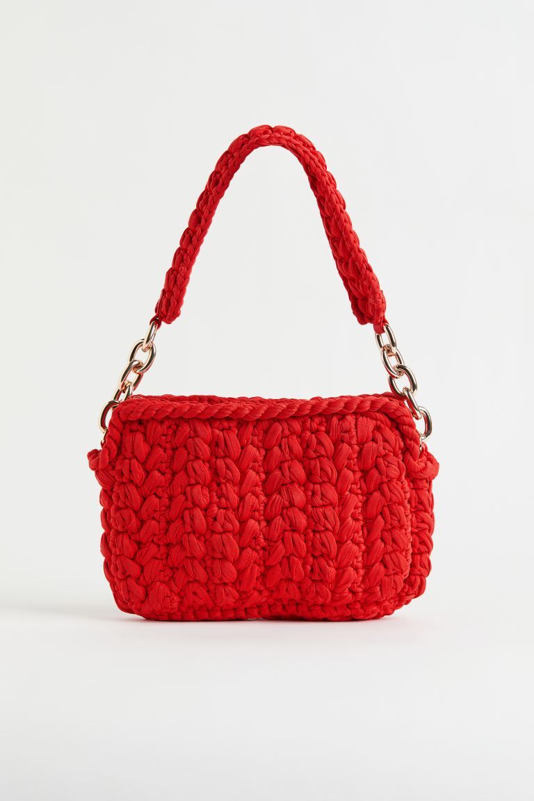 Shoulder bag in crochet-look jersey. Handle at the top with chunky metal anchor chain at each end... | H&M (US + CA)