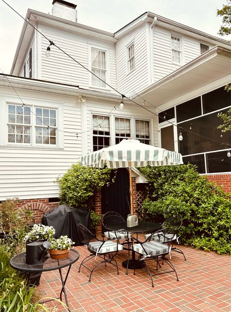 Outdoor furniture 
Wrought iron dining set
Better homes and gardens furniture 
Studio Mc Gee Target Outdoor Cushions
Stripe Umbrella 

#LTKhome #LTKSeasonal