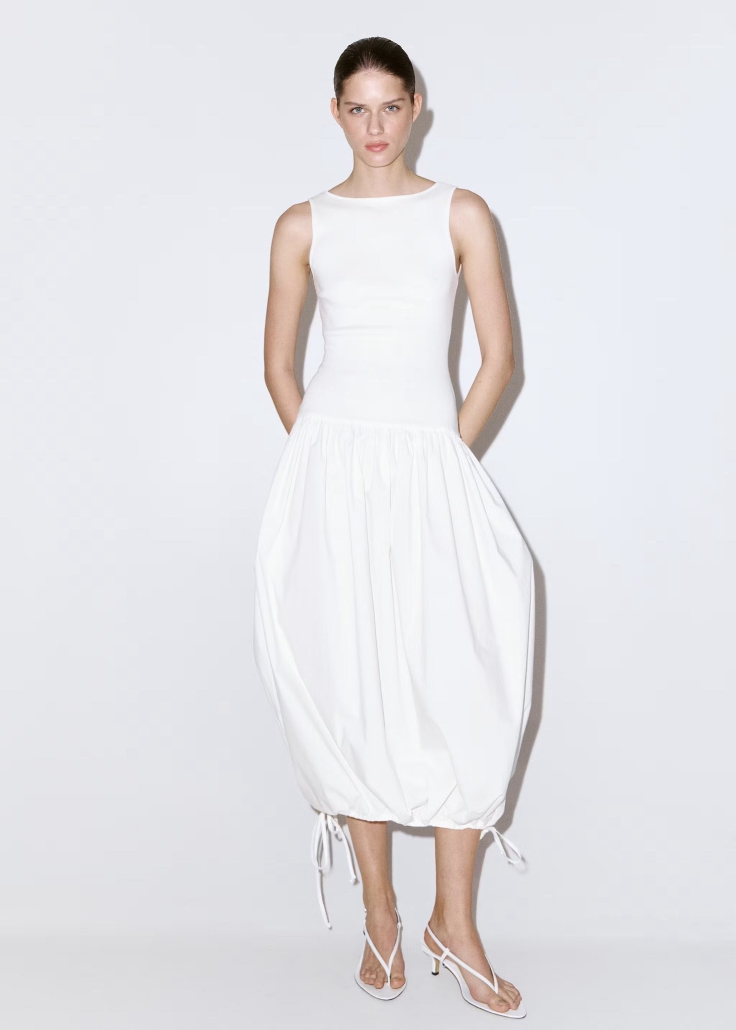 The perfect white summer dress. You can keep it flowy or tighten for a bubble effect.