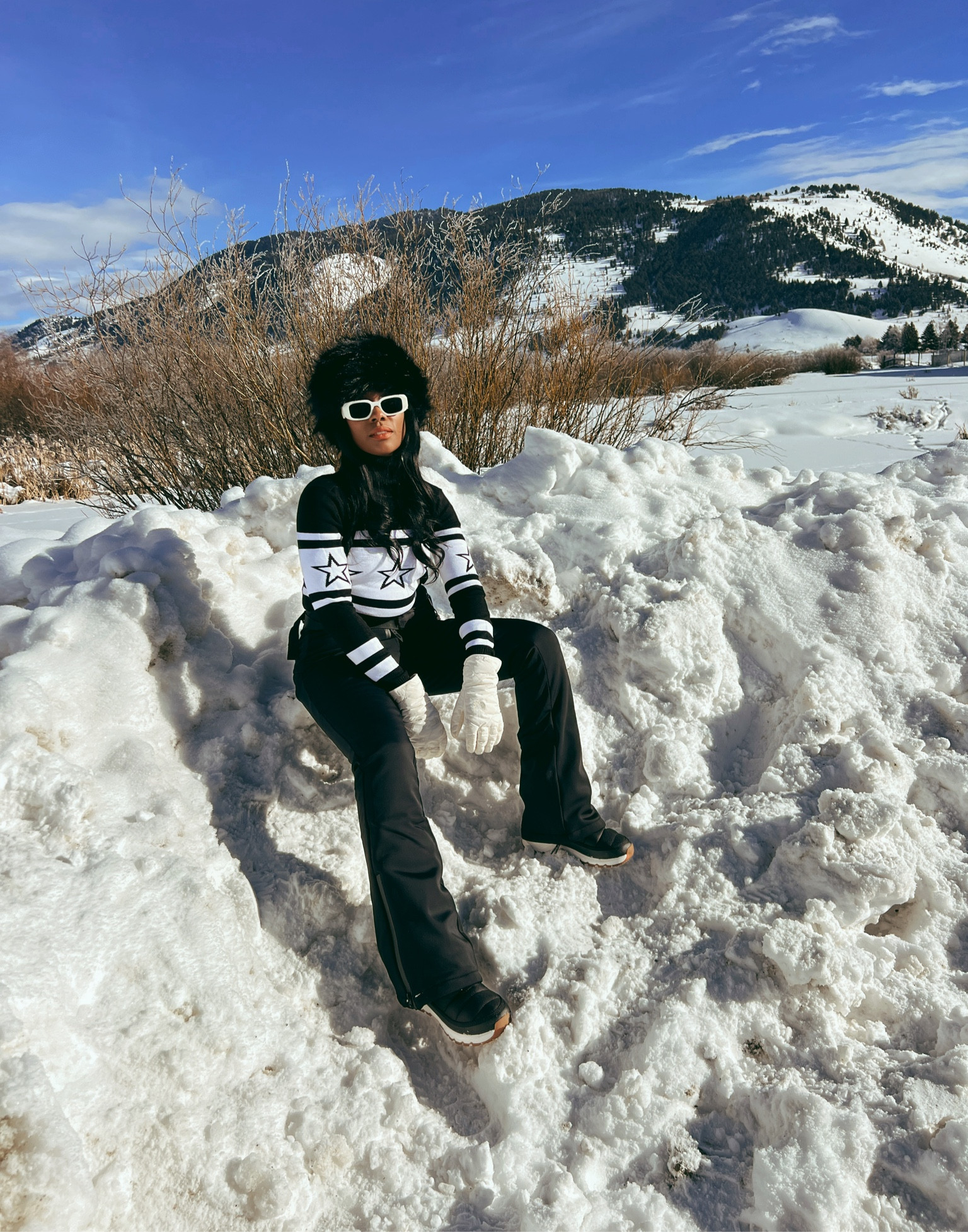 Ski outfit: black overall jumpsuit, star turtleneck sweater (great dupe), white sunglasses, black faux fur hat, snow boots 

#LTKshoecrush #LTKstyletip #LTKtravel