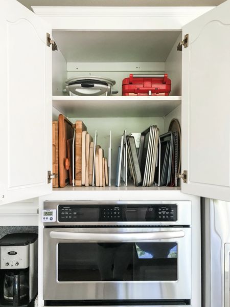 This cabinet above the oven was previously a huge wide open opportunity. Using simple, inexpensive tray dividers, I created tons of space for their cutting boards, baking sheets, and more! These are easily installed using only a measuring tape, level, screwdriver, and pen. A quick and easy project that you can complete to create more space in your kitchen!

#LTKhome #LTKfamily #LTKVideo