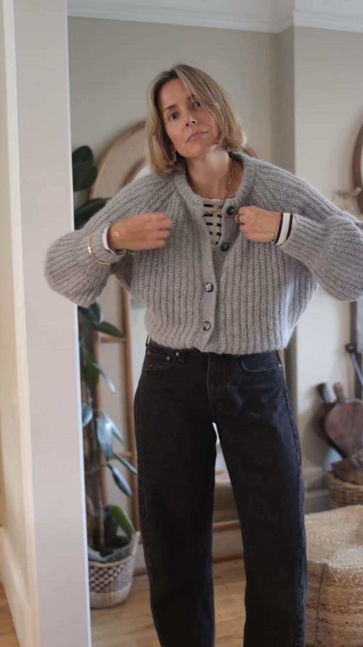 Barrel jeans
Grey cardigan 
Grey knit 
Striped top 
Square toe boots 
Brown coat 
Brown outfit 
Suede bag 

#LTKuk #LTKwinter #LTKeurope