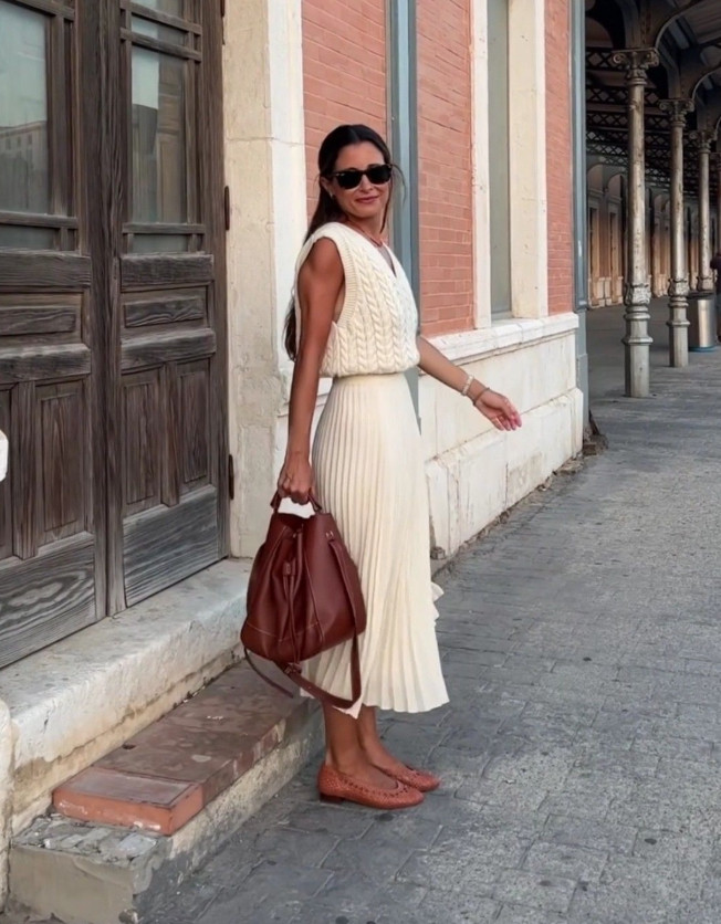 This soft monochrome outfit pairs a textured knit vest with a pleated skirt for an effortlessly elegant look.
Warm leather accessories and classic flats add contrast, creating a timeless outfit that feels both polished and relaxed. 

 #LTKdayinmylife #LTKootd